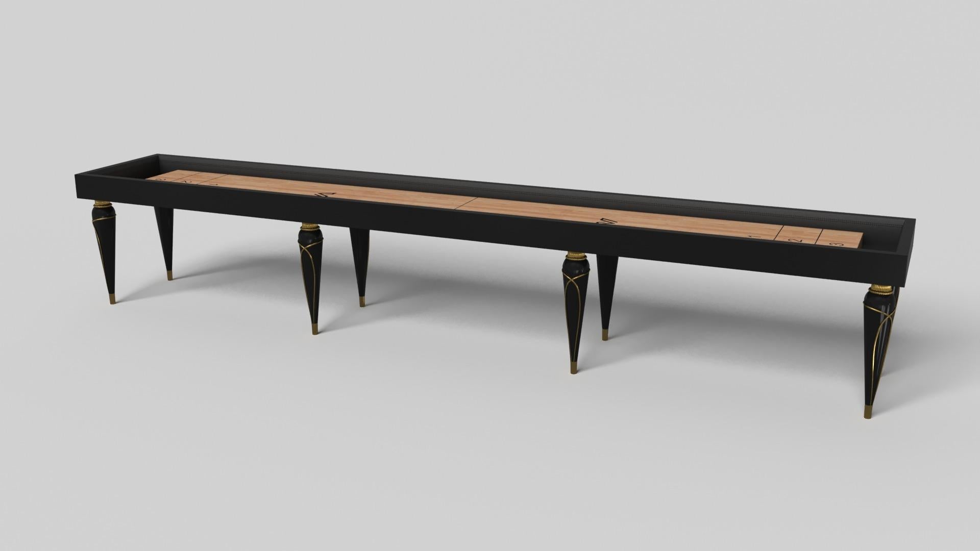 Champagne gold accents add undeniable elegance to this luxury shuffleboard table. Offering superior playability and uncompromised style, this design features hand carved details, decorative metal elements, and metal sabots at the bottom of each leg.