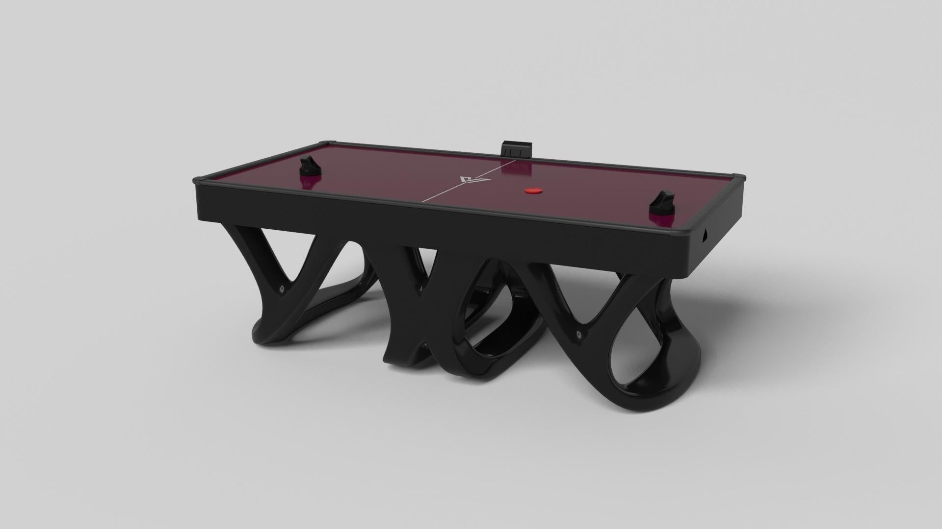Inspired by the work of Antoni Gaudi and the movement of Catalan Modernism, the Draco air hockey table in walnut boasts bold style with smooth, curved legs and a crisp black top. Expertly crafted from hard wood, this table features a high-end,