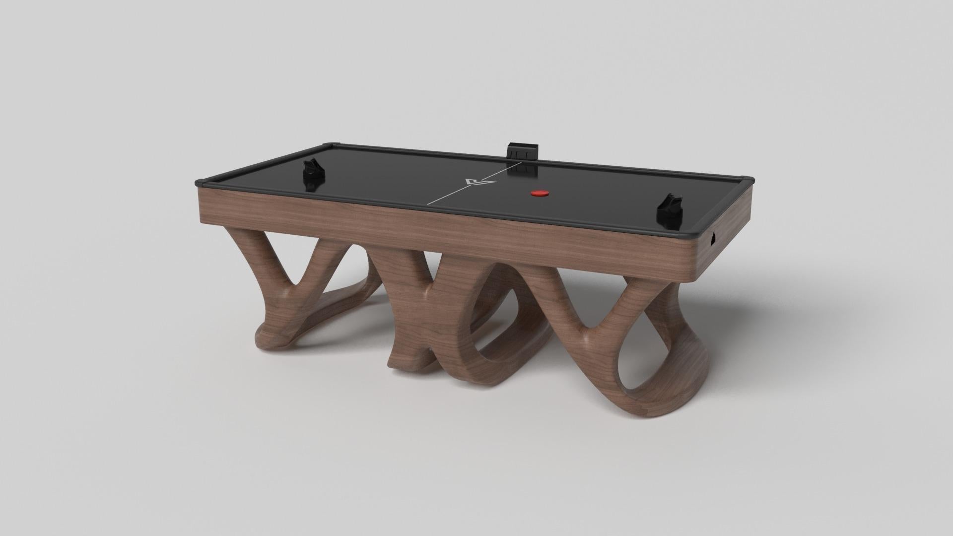 Inspired by the work of Antoni Gaudi and the movement of Catalan Modernism, the Draco air hockey table in walnut boasts bold style with smooth, curved legs and a crisp black top. Expertly crafted from hard wood, this table features a high-end,