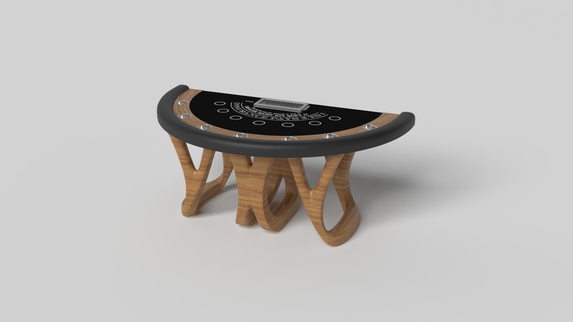 Inspired by the work of Antoni Gaudi and the movement of Catalan Modernism, the Draco blackjack table in walnut boasts bold style with smooth, curved legs and a casino-grade table top with a chip rack and betting circles for professional game play.