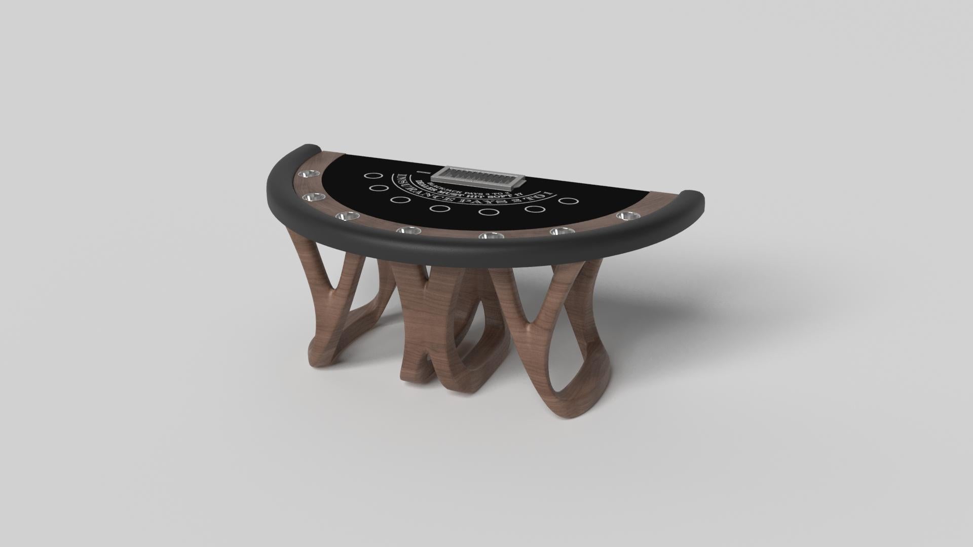 Inspired by the work of Antoni Gaudi and the movement of Catalan Modernism, the Draco blackjack table in walnut boasts bold style with smooth, curved legs and a casino-grade table top with a chip rack and betting circles for professional game play.