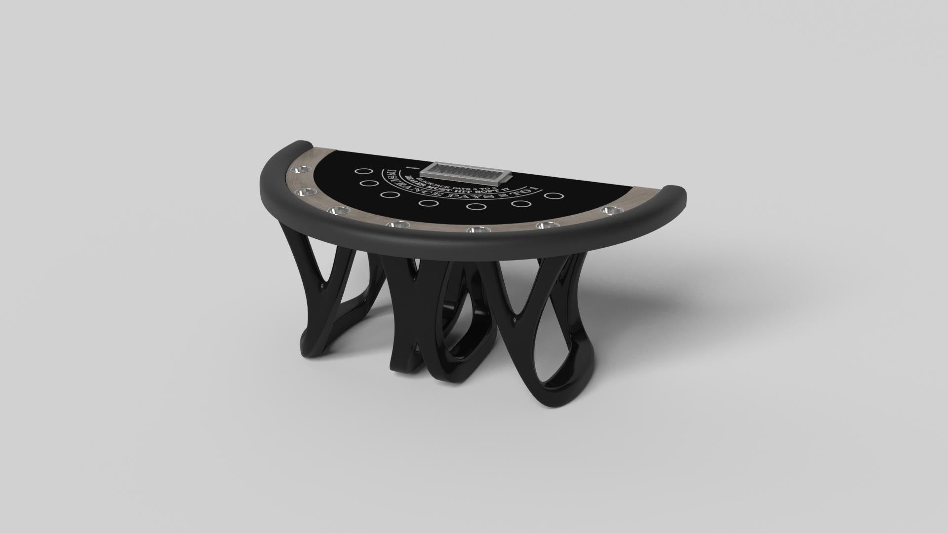 Inspirée par l'œuvre d'Antoni Gaudi et le mouvement du modernisme catalan, la table de blackjack Draco en noyer affiche un style audacieux avec des pieds lisses et incurvés et un plateau de table de qualité casino avec un support de jetons et des