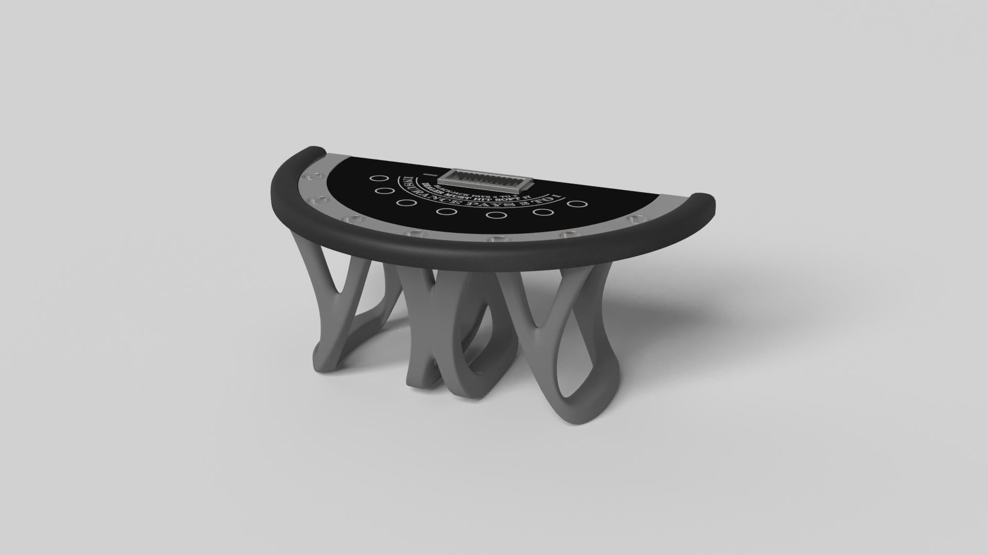 Inspirée par l'œuvre d'Antoni Gaudi et le mouvement du modernisme catalan, la table de blackjack Draco en noyer affiche un style audacieux avec des pieds lisses et incurvés et un plateau de table de qualité casino avec un support de jetons et des
