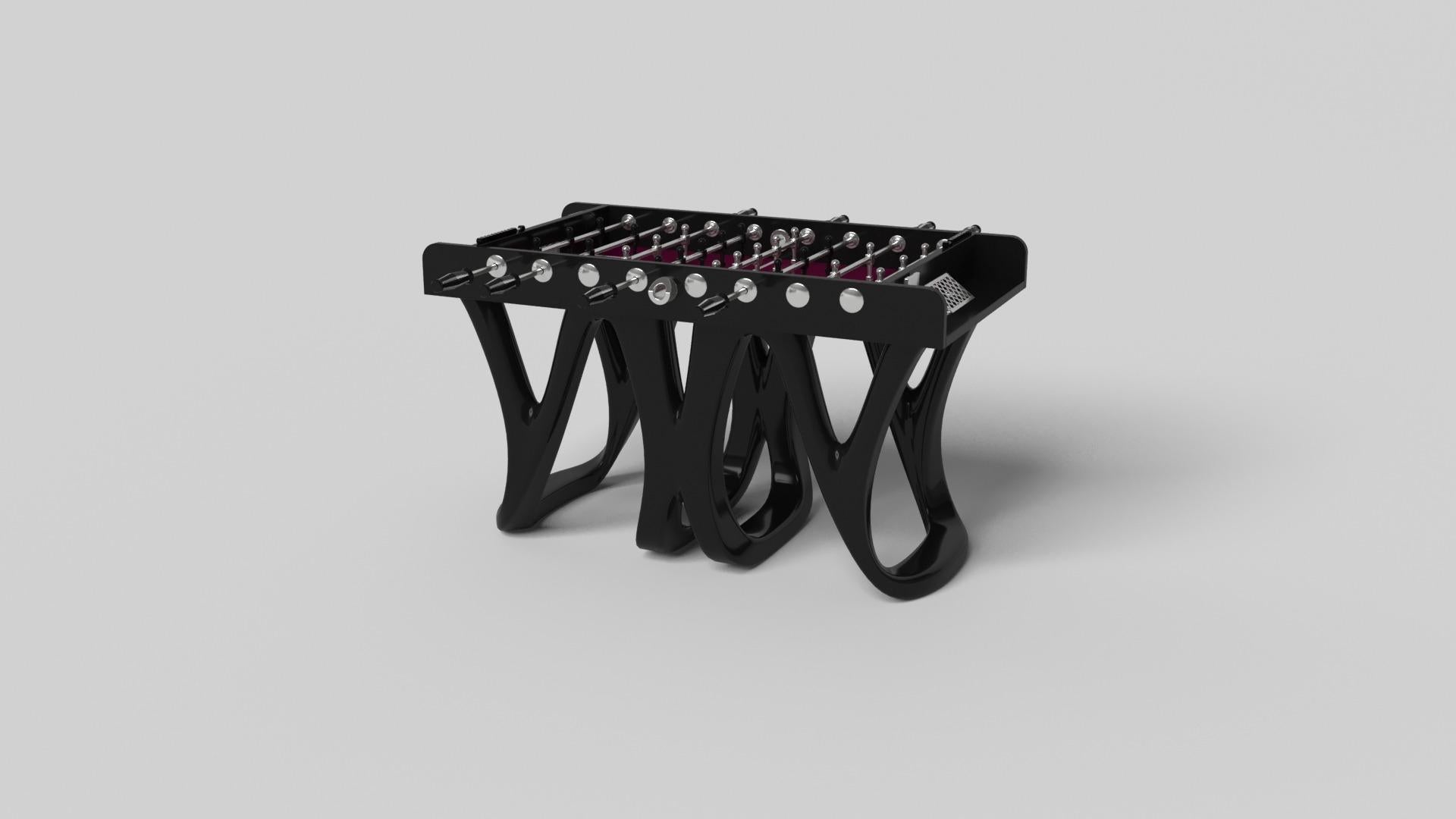 Inspired by the work of Antoni Gaudi and the movement of Catalan Modernism, the Draco foosball table in walnut boasts bold style with smooth, curved legs and a detailed surface for professional game play. Expertly crafted from solid wood, this table