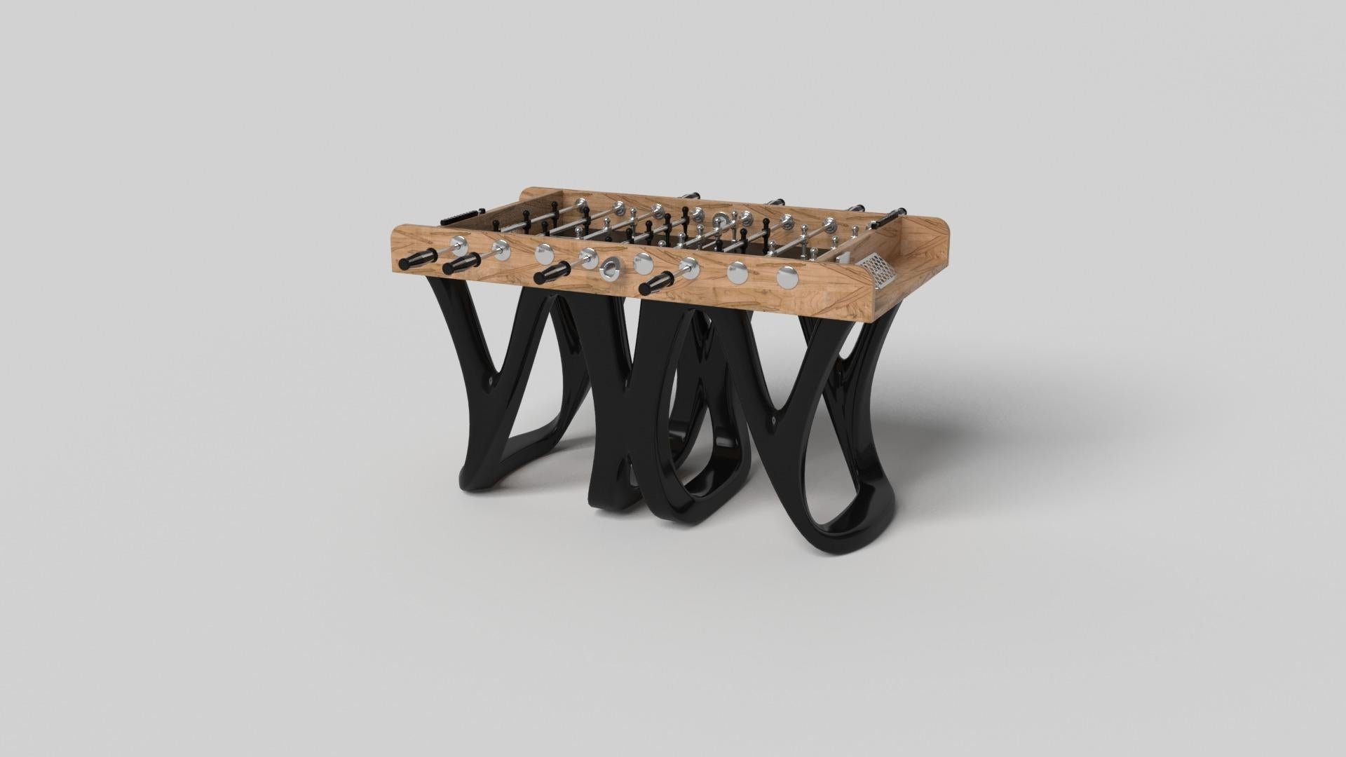 Inspired by the work of Antoni Gaudi and the movement of Catalan Modernism, the Draco foosball table in walnut boasts bold style with smooth, curved legs and a detailed surface for professional game play. Expertly crafted from solid wood, this table