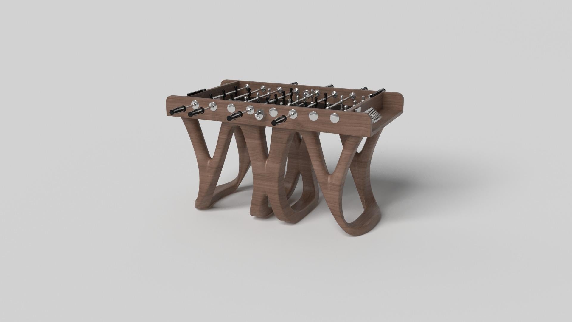 Inspired by the work of Antoni Gaudi and the movement of Catalan Modernism, the Draco foosball table in walnut boasts bold style with smooth, curved legs and a detailed surface for professional game play. Expertly crafted from solid wood, this table