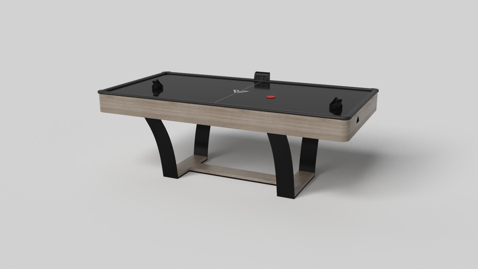 Mit seinem I-förmigen Metallsockel, den leicht abgeschrägten Metallbeinen und der kontrastierenden Holzplatte strahlt der Elite-Airhockeytisch moderne Raffinesse aus und erinnert gleichzeitig an das Art-Déco-Design. Dieser Tisch ist ein Stilmix, der