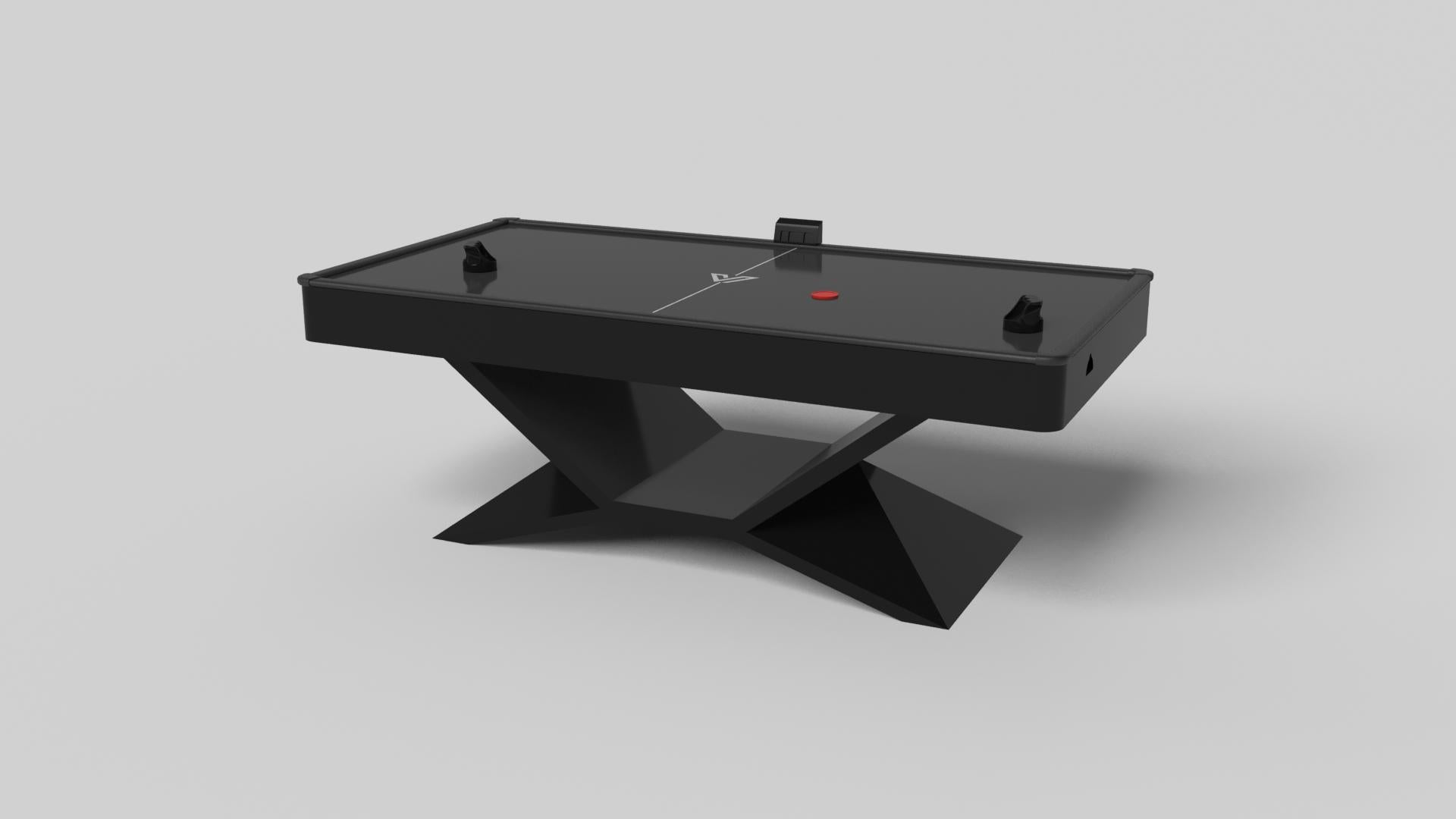 In chrome metal, the Kors air hockey table is a superior example of contrasting geometric forms. This table features an angular base that highlights the beauty of negative space from the front view. From the side view, it offers a completely