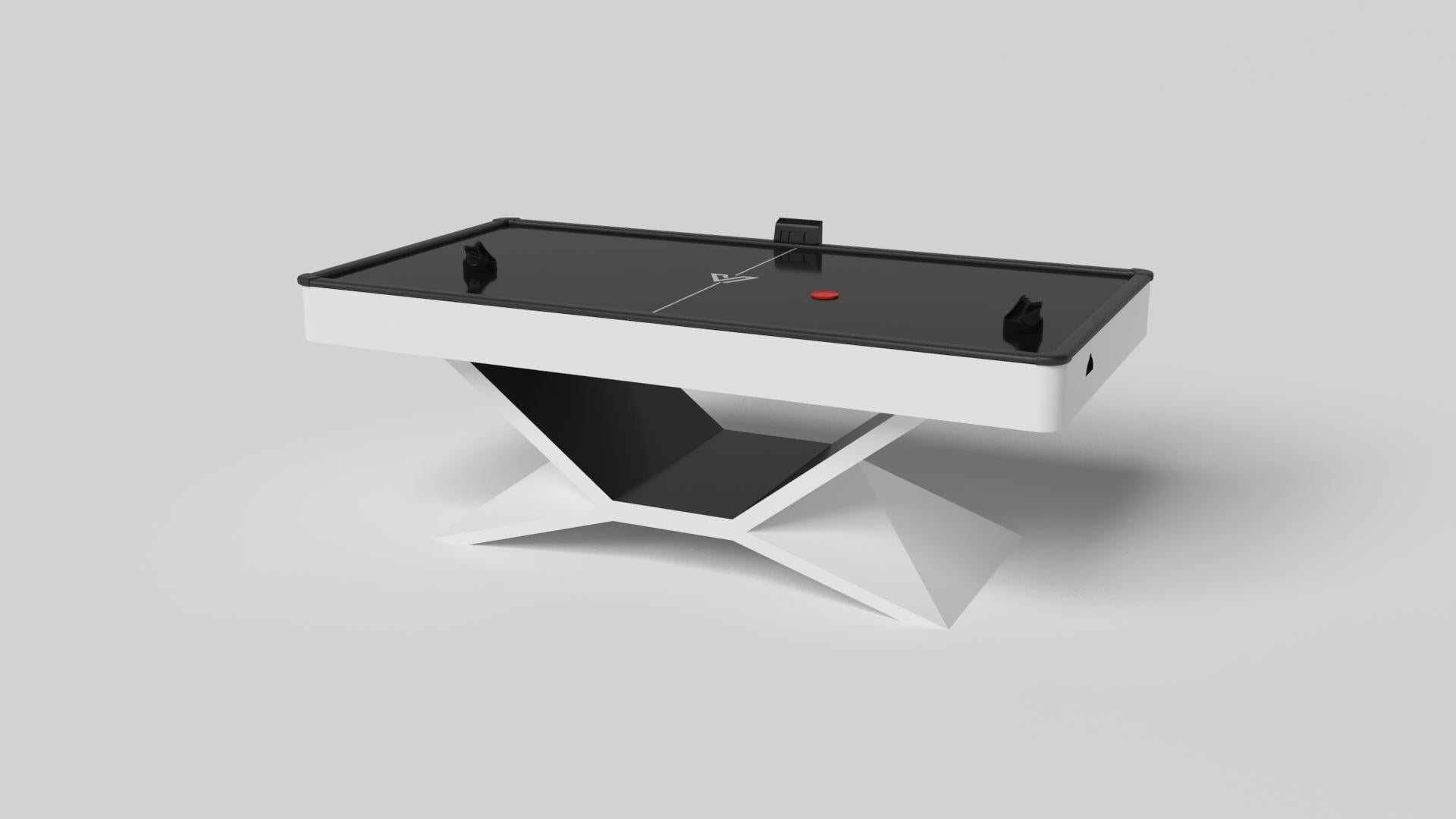 In chrome metal, the Kors air hockey table is a superior example of contrasting geometric forms. This table features an angular base that highlights the beauty of negative space from the front view. From the side view, it offers a completely