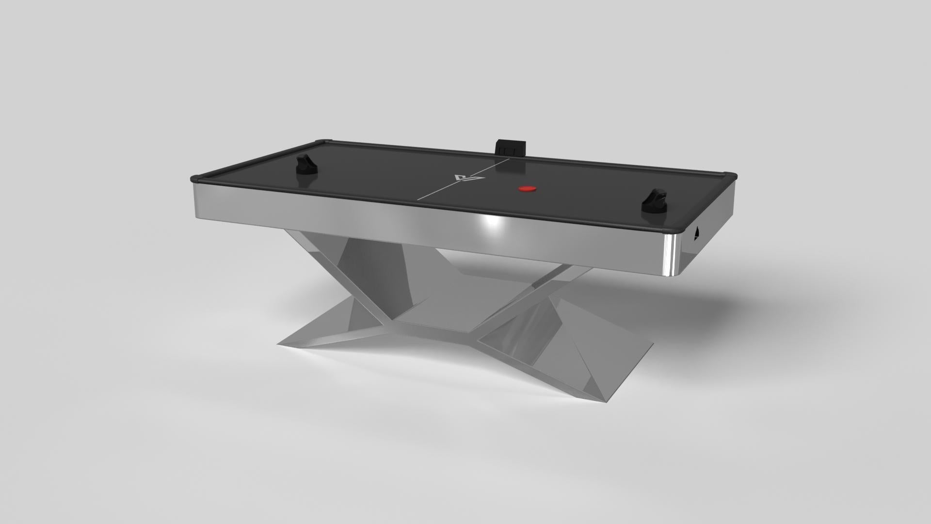 In chrome metal, the Kors air hockey table is a superior example of contrasting geometric forms. This table features an angular base that highlights the beauty of negative space from the front view. From the side view, it offers a completely