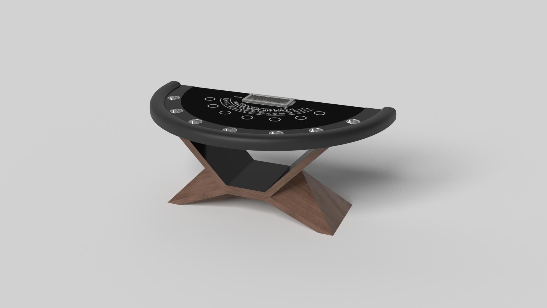 In chrome metal, the Kors blackjack table is a superior example of contrasting geometric forms. This table features an angular base that highlights the beauty of negative space from the front view. From the side view, it offers a completely