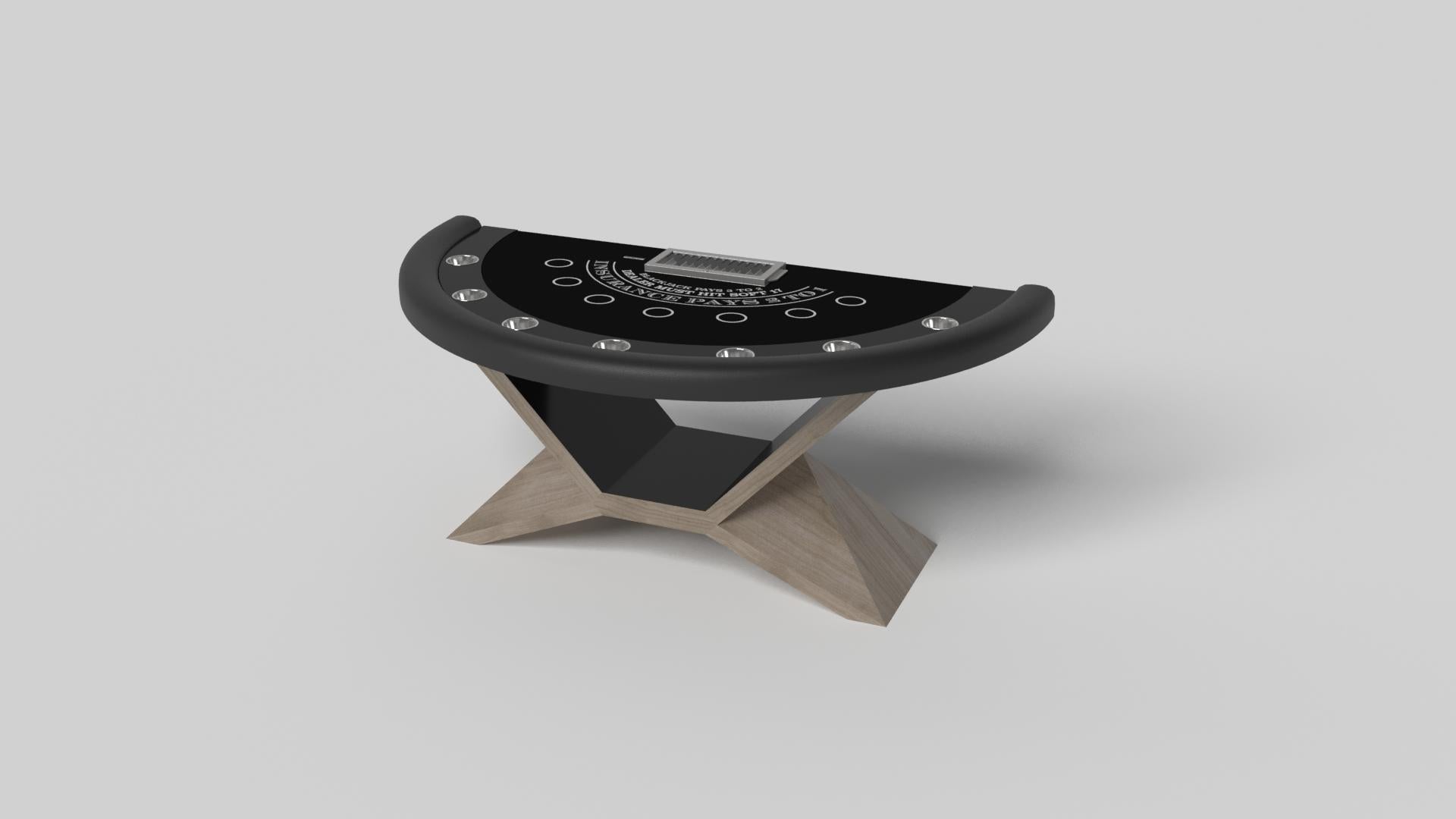 In chrome metal, the Kors blackjack table is a superior example of contrasting geometric forms. This table features an angular base that highlights the beauty of negative space from the front view. From the side view, it offers a completely