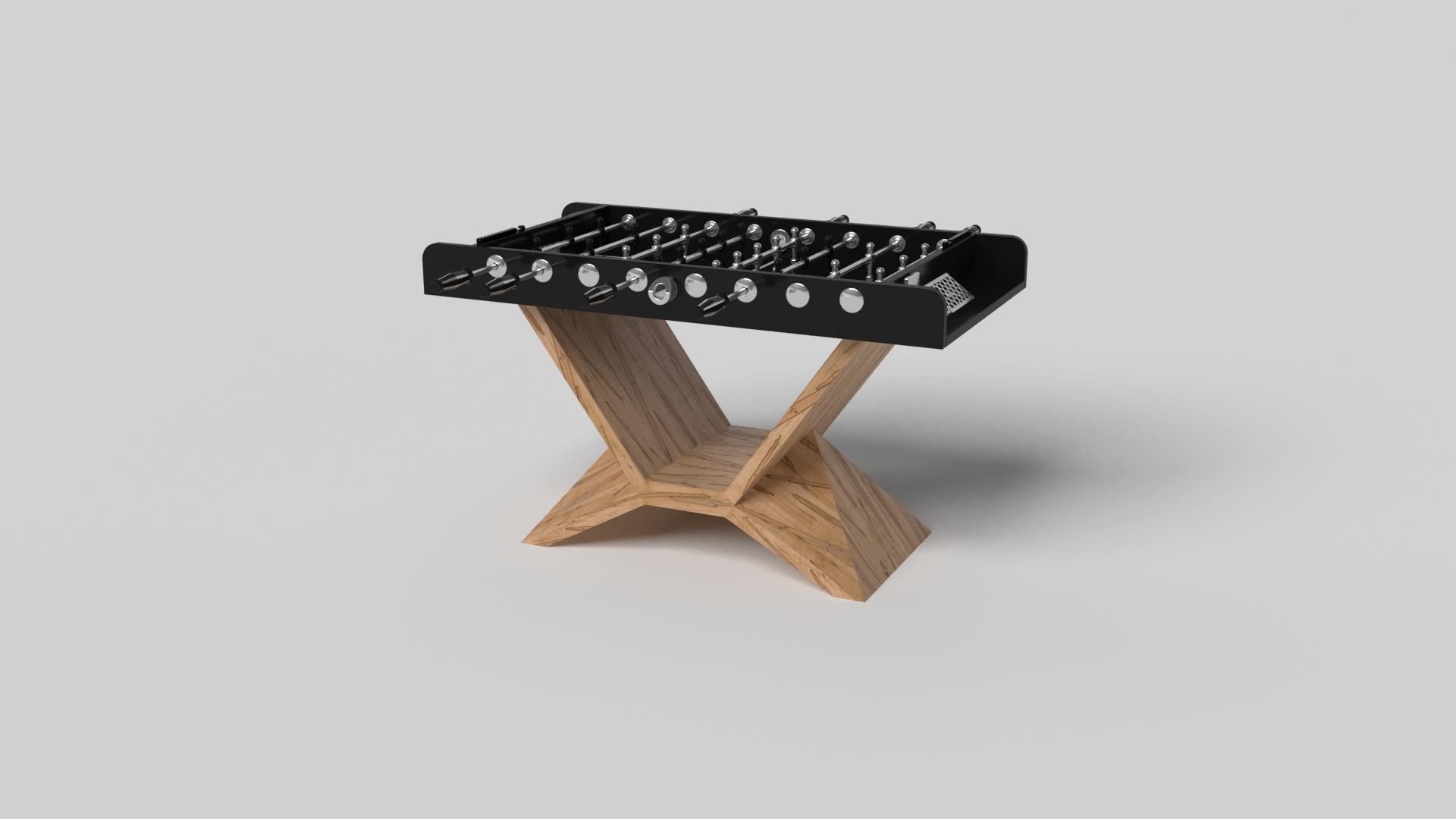 In chrome, the Kors foosball table is a superior example of contrasting geometric forms. This table features an angular base that highlights the beauty of negative space from the front view. From the side view, it offers a completely different