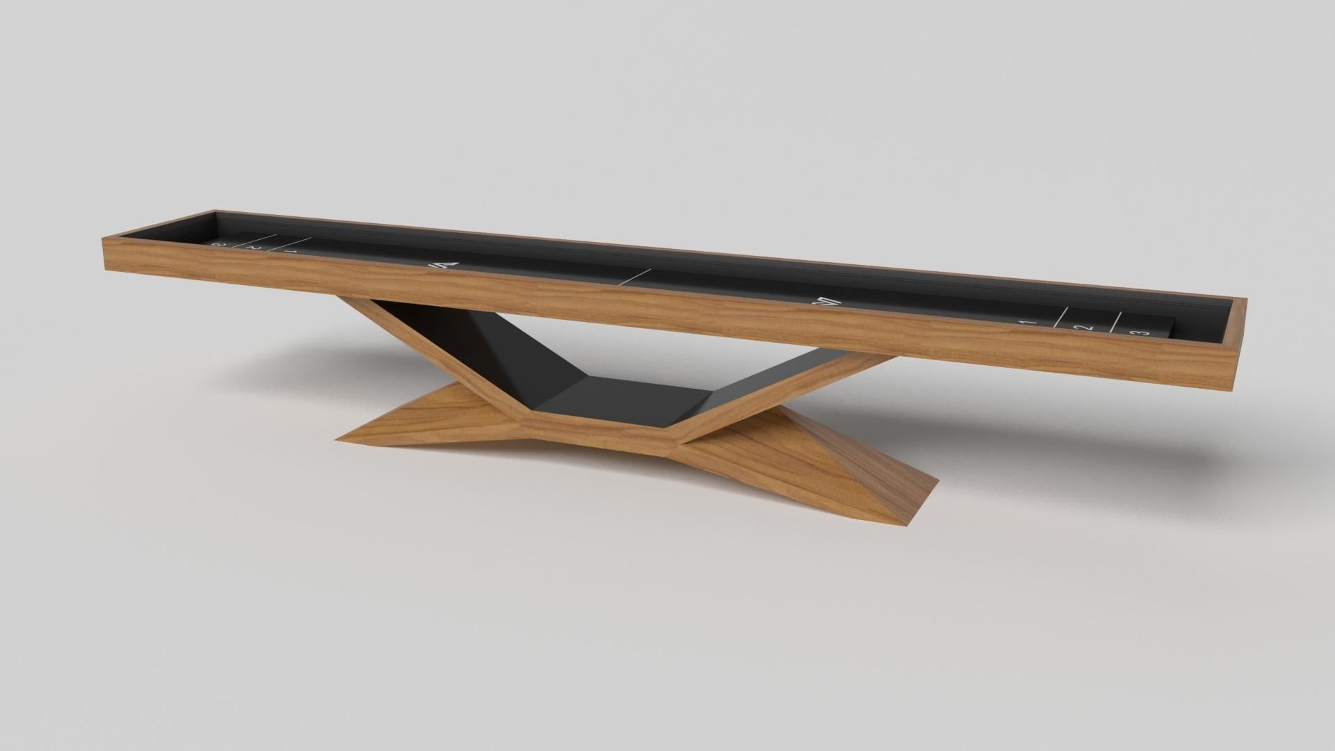 In chrome, the Kors shuffleboard table is a superior example of contrasting geometric forms. This table features an angular base that highlights the beauty of negative space from the front view. From the side view, it offers a completely different