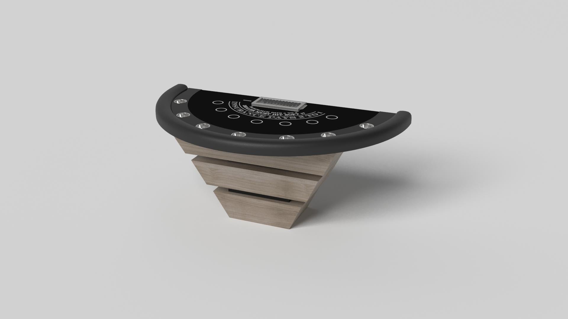 Three solid pieces of wood seemingly float around a concealed center base, making the Louve blackjack table in brushed aluminum one of our most mind-bending designs. Crafted from solid wood and detailed with a chip rack and betting circles, this