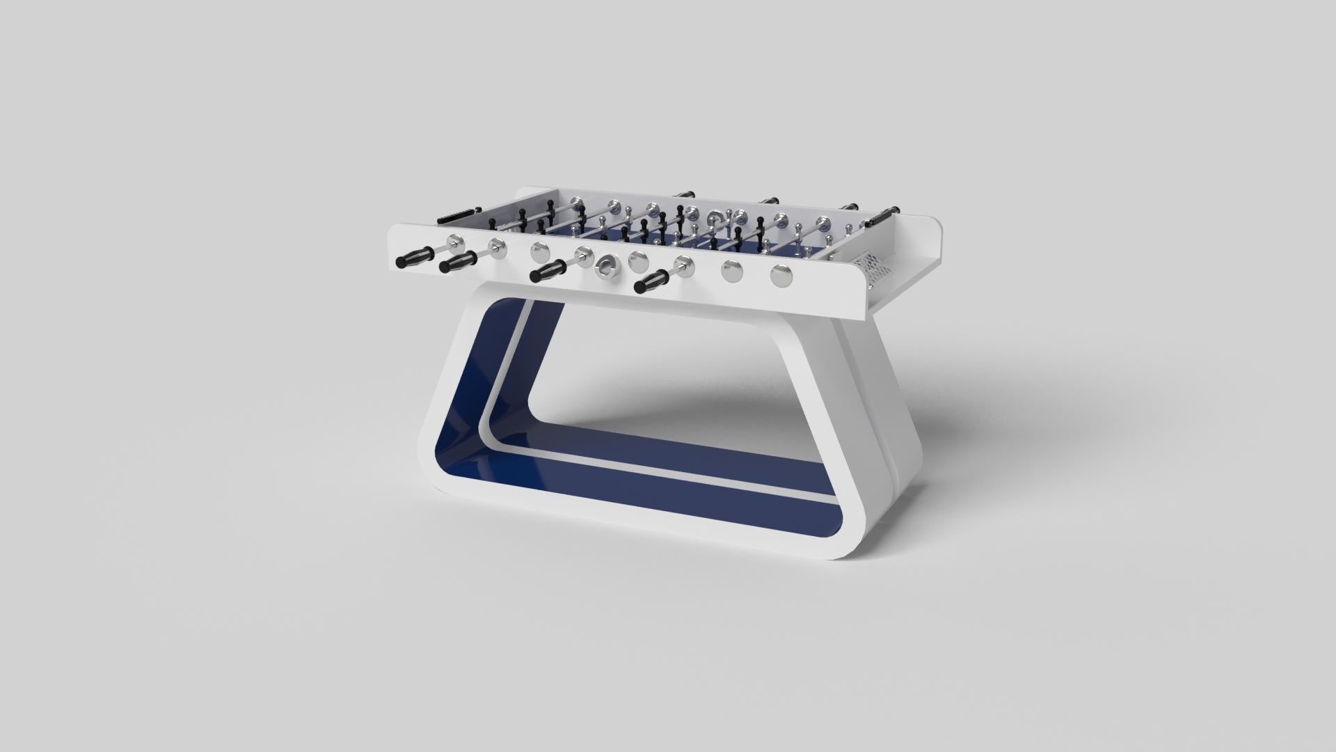 An open base with sweeping curves and smooth edges imparts a light, airy feel upon the Luge foosball table in walnut. Evoking a sense of speed and the spirit of continuous movement, this exclusive wood game table features a split base with open
