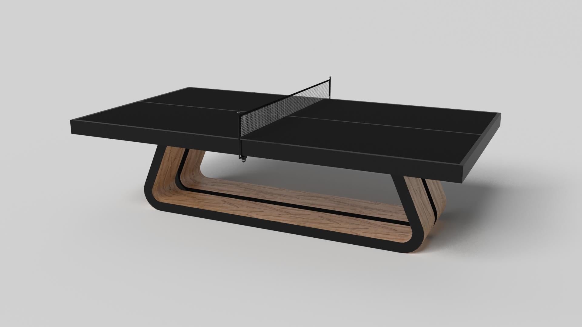An open base with sweeping curves and smooth edges imparts a light, airy feel upon the Luge table tennis table in walnut. Evoking a sense of speed and the spirit of continuous movement, this exclusive wood game table features a split base with open