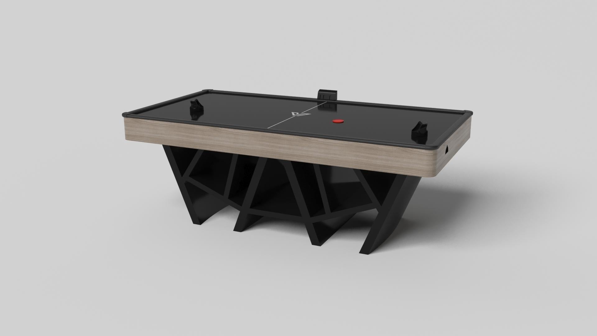 Mit einer Kombination aus spitzen Winkeln, glatten Linien und geometrischen Konfigurationen zeichnet sich der Airhockey-Tisch Maze aus Nussbaum durch ein vom Labyrinth inspiriertes Untergestell mit einem geheimnisvollen Motiv aus. Dieser luxuriöse