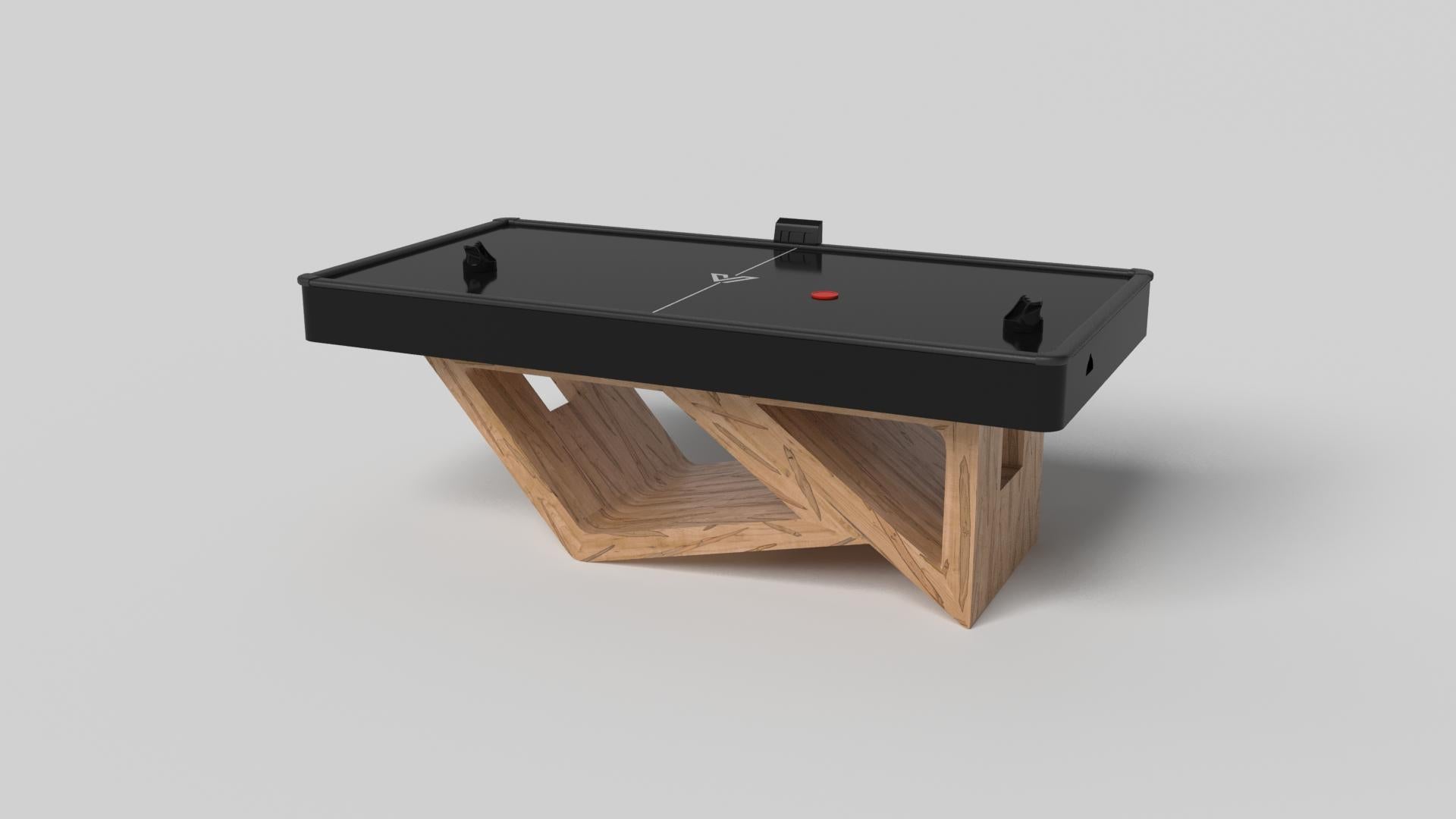 Drawing inspiration from the beauty of geometric forms, the Rumba air hockey table in brushed aluminum is characterized by a series of hollow and solid shapes that form an offset asymmetric base. Accented with a black top for professional game play,