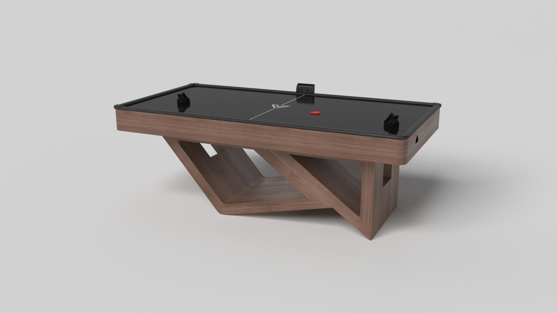 Drawing inspiration from the beauty of geometric forms, the Rumba air hockey table in brushed aluminum is characterized by a series of hollow and solid shapes that form an offset asymmetric base. Accented with a black top for professional game play,