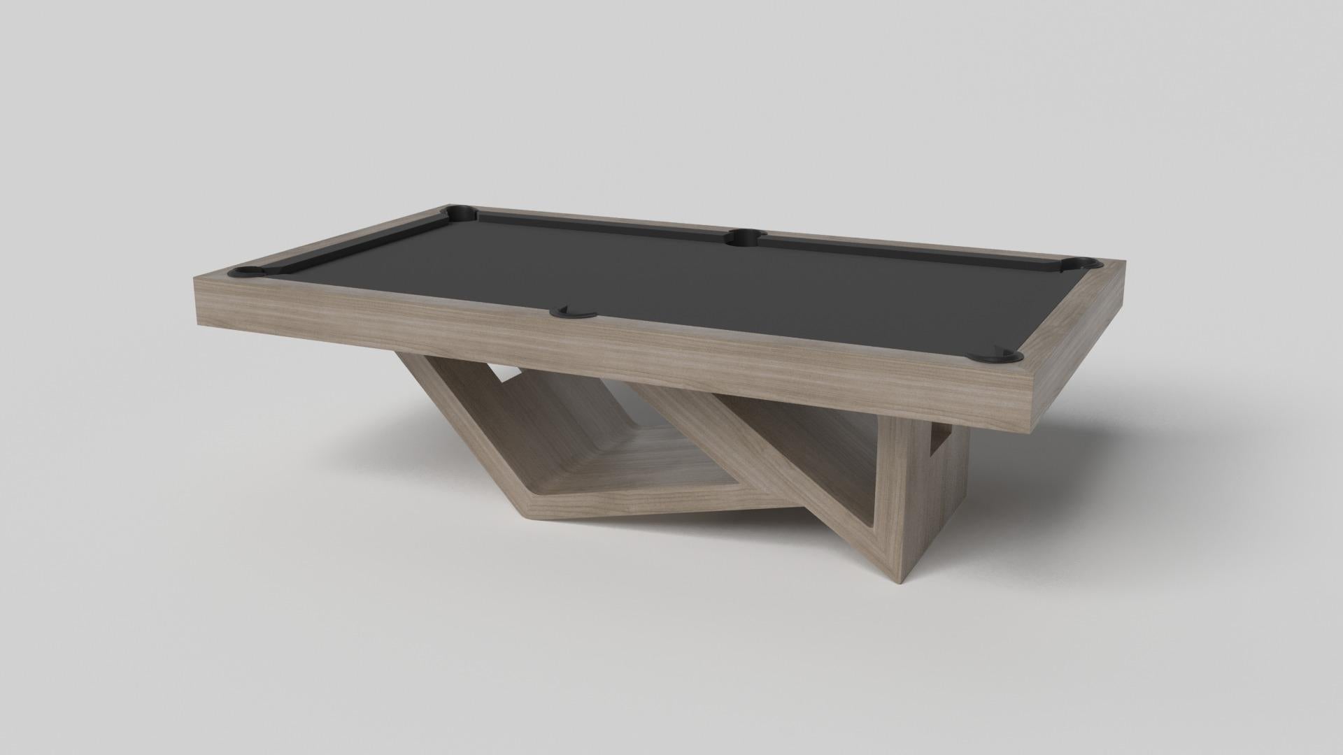 Drawing inspiration from the beauty of geometric forms, the Rumba pool table in brushed aluminum is characterized by a series of hollow and solid shapes that form an offset asymmetric base. Accented with a felt top for professional game play, this