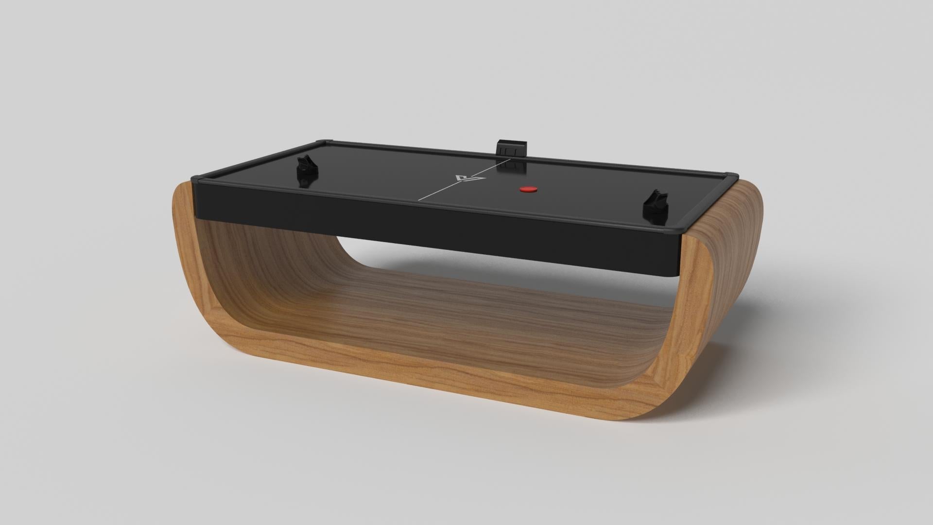 Handcrafted with intricate accents and a precision-carved curved base, the Sid air hockey table in black encompasses a series of smooth edges, distinctive details, and unconventional elements in one unique expression of luxury design. Built by hand