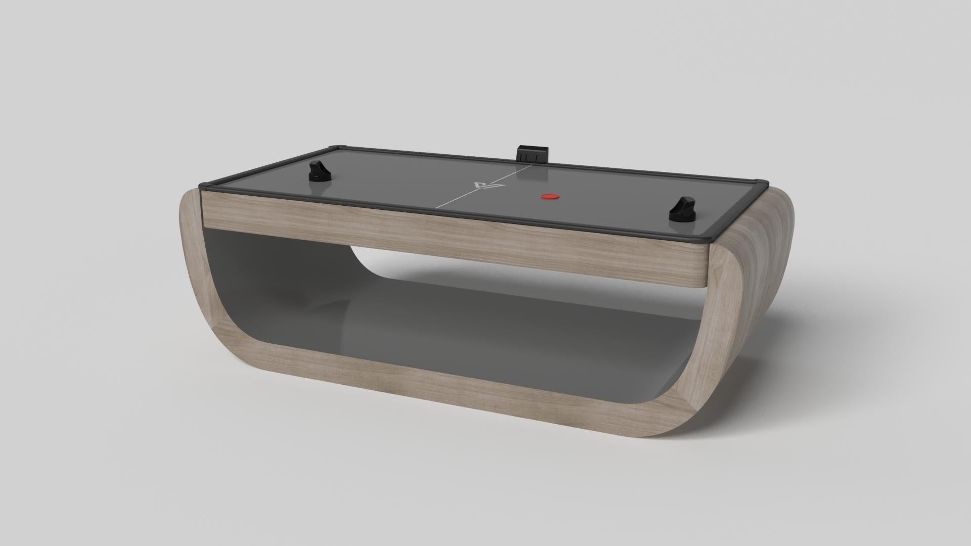 Handcrafted with intricate accents and a precision-carved curved base, the Sid air hockey table in black encompasses a series of smooth edges, distinctive details, and unconventional elements in one unique expression of luxury design. Built by hand