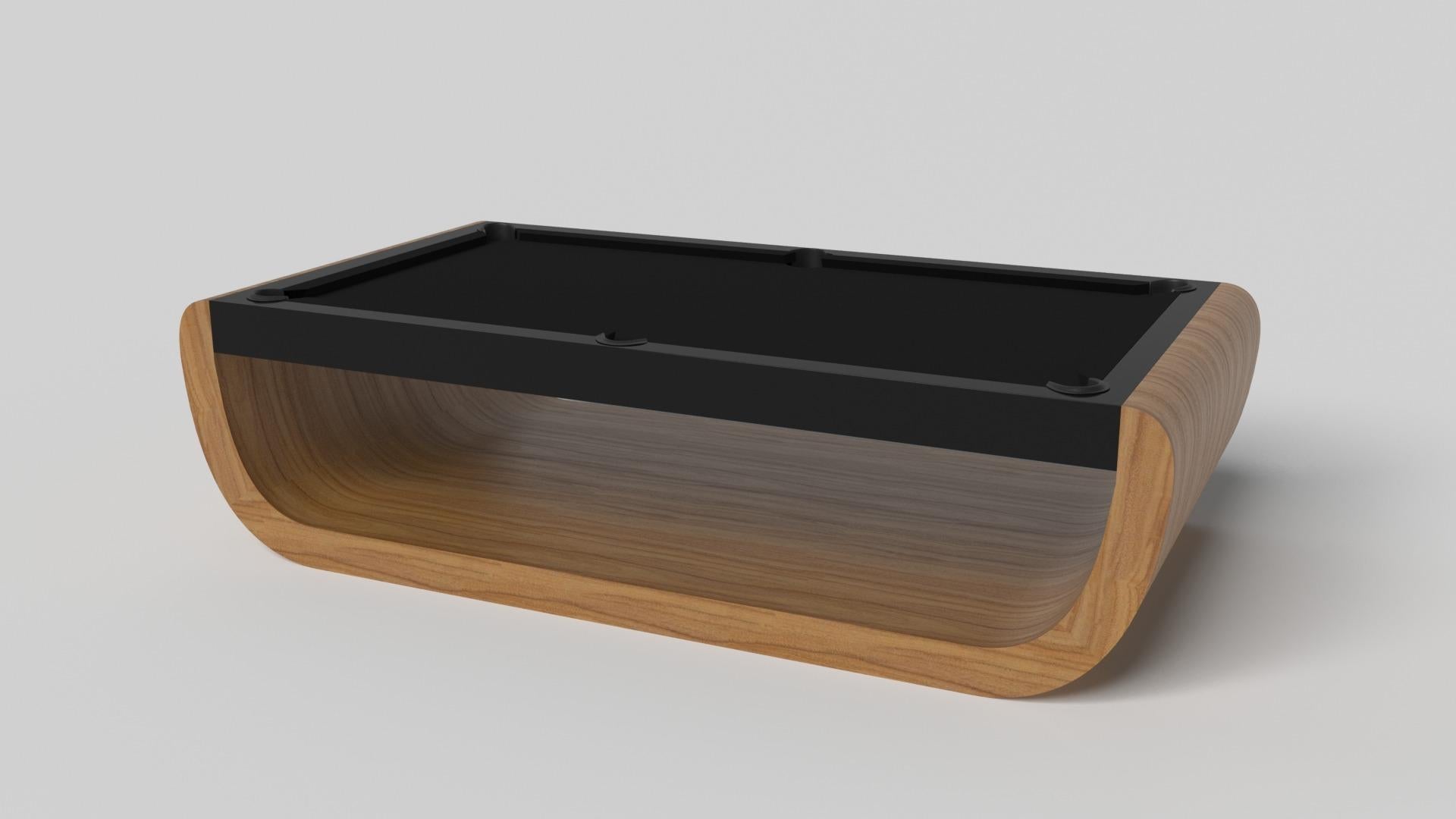 Handcrafted with intricate accents and a precision-carved curved base, the Sid pool table in black encompasses a series of smooth edges, distinctive details, and unconventional elements in one unique expression of luxury design. Built by hand from