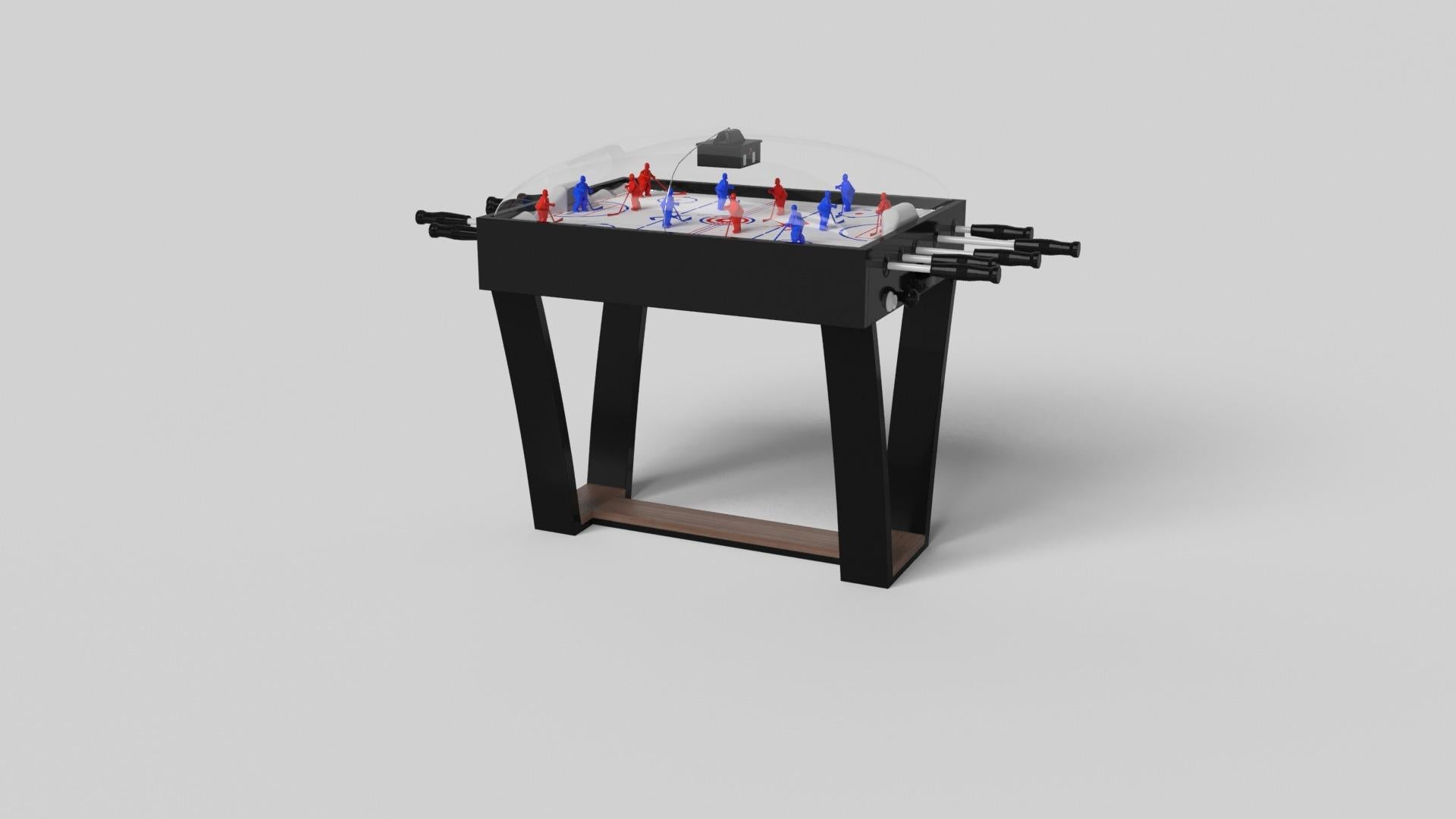 Con una base metálica en forma de I, patas metálicas ligeramente inclinadas y un tablero de madera en contraste, la mesa de hockey de cúpula Elite destila sofisticación moderna a la vez que evoca una sensación de diseño art déco. Esta mesa es una