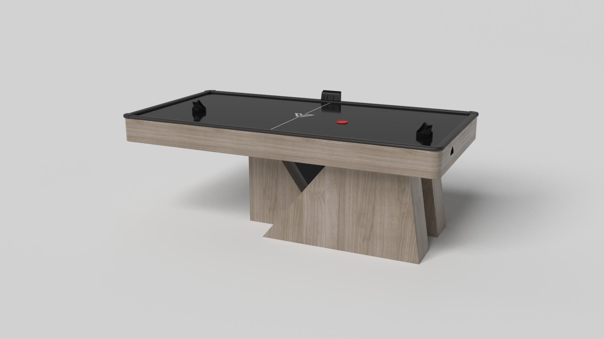 Una base asimétrica crea una silueta que flota libremente, haciendo de la mesa de hockey aéreo Stilt en cromo con nogal un complemento convincente y contemporáneo para el hogar moderno. Fabricada en metal duradero con detalles de madera maciza de