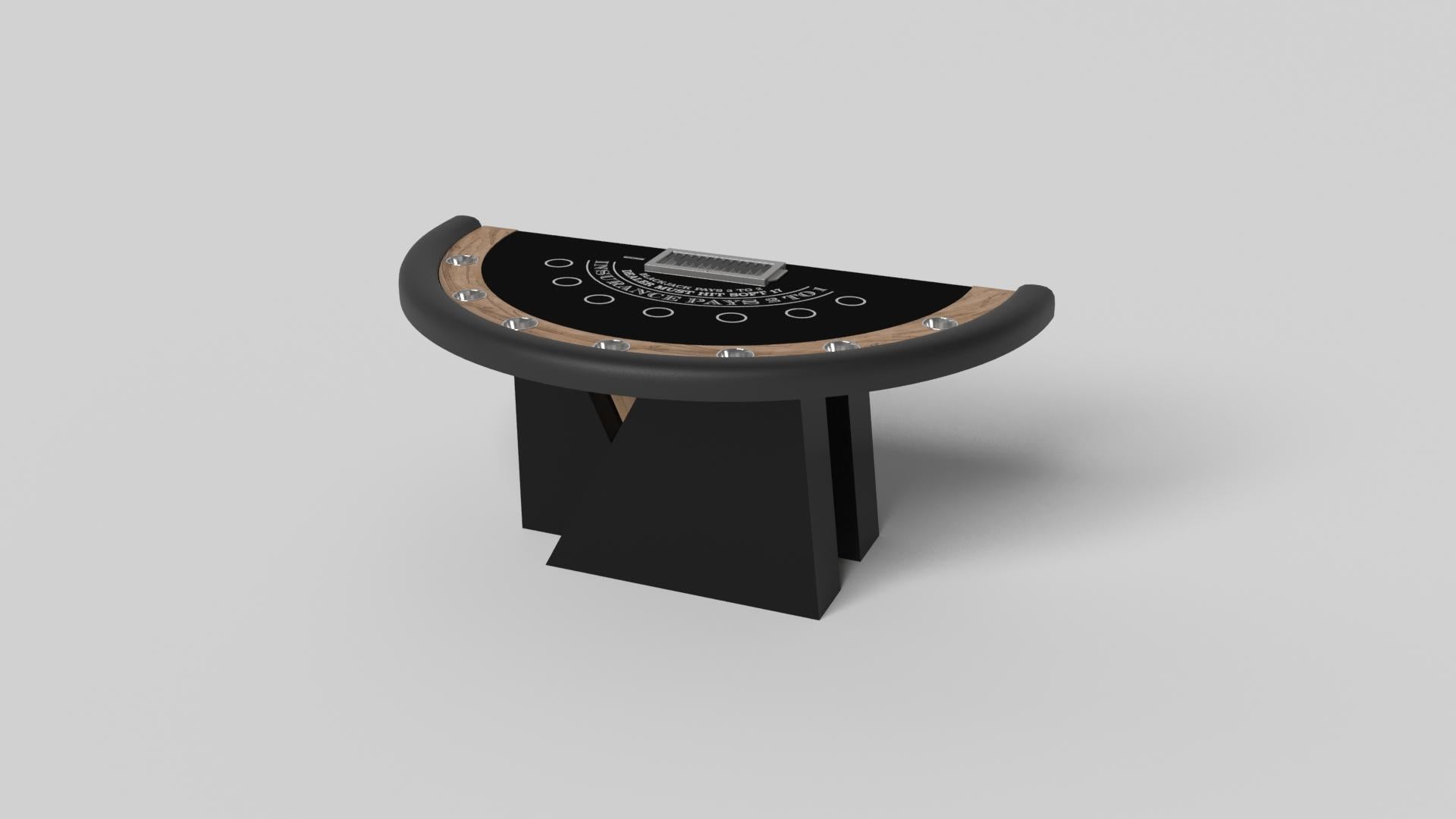 Una base asimmetrica crea una silhouette libera, rendendo il tavolo da blackjack Stilt in noce un'aggiunta irresistibile e contemporanea alla casa moderna. Caratterizzato da un porta-fiches e da cerchi per le scommesse, questo lussuoso tavolo da