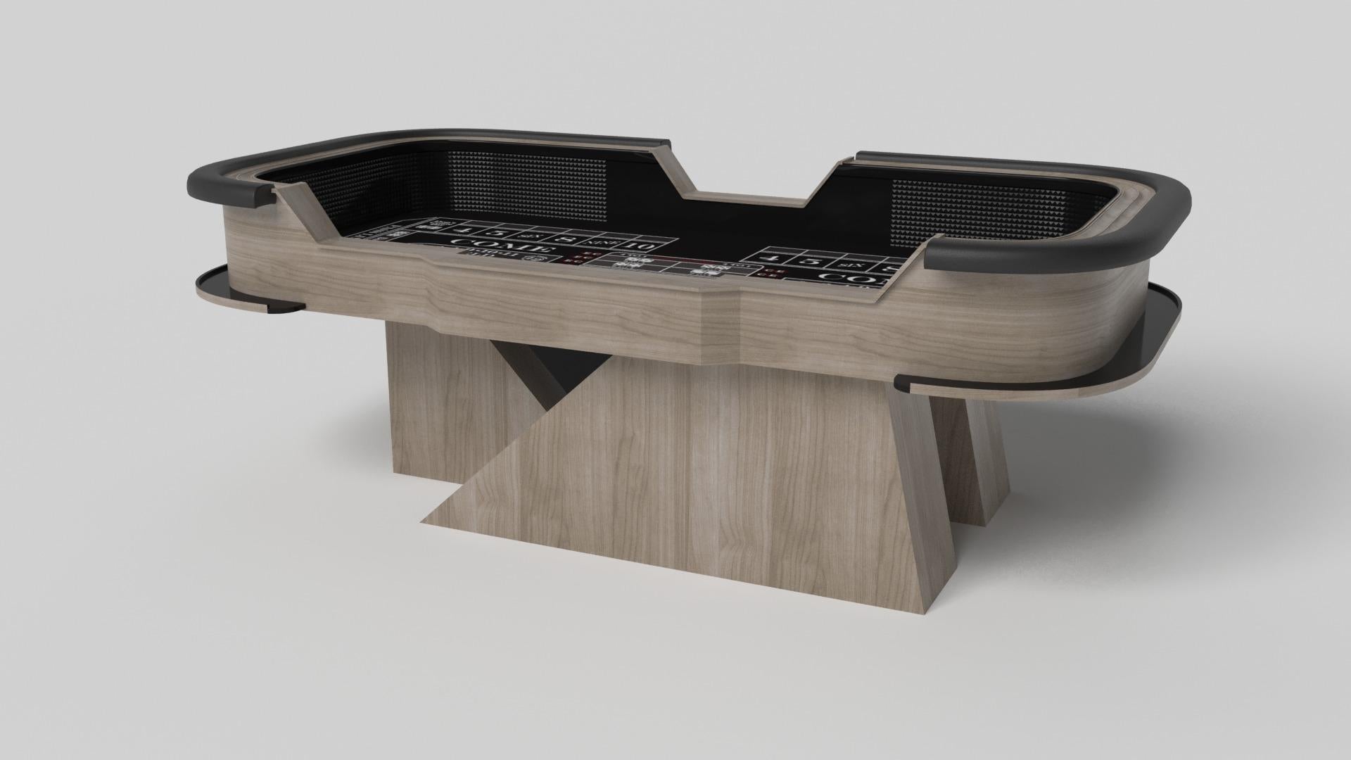 An asymmetric base creates a free-floating silhouette, making the Stilt craps table in walnut a compelling, contemporary addition to the modern home. Detailed with point boxes and betting blocks, this luxury handcrafted game table boasts an