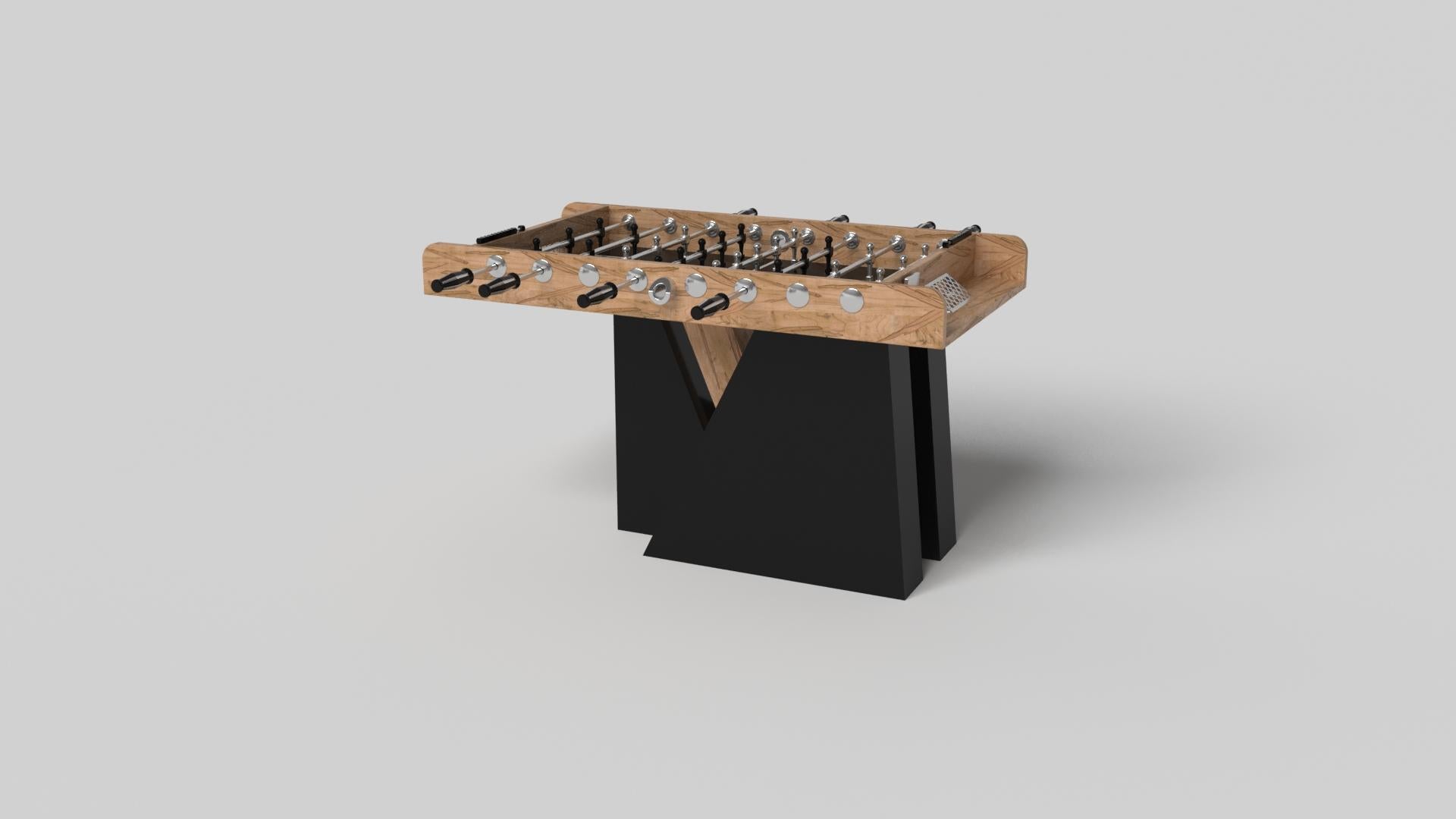 An asymmetric base creates a free-floating silhouette, making the Stilt foosball table in chrome with walnut a compelling, contemporary addition to the modern home. Crafted from durable metal with solid walnut wood accents, this luxury handcrafted