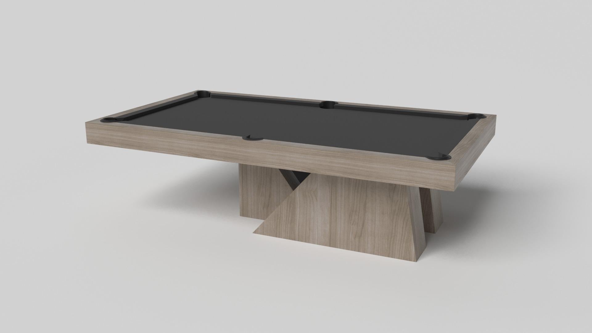 An asymmetric base creates a free-floating silhouette, making the Stilt pool table in chrome with walnut a compelling, contemporary addition to the modern home. Crafted from durable metal with solid walnut wood accents, this luxury handcrafted game