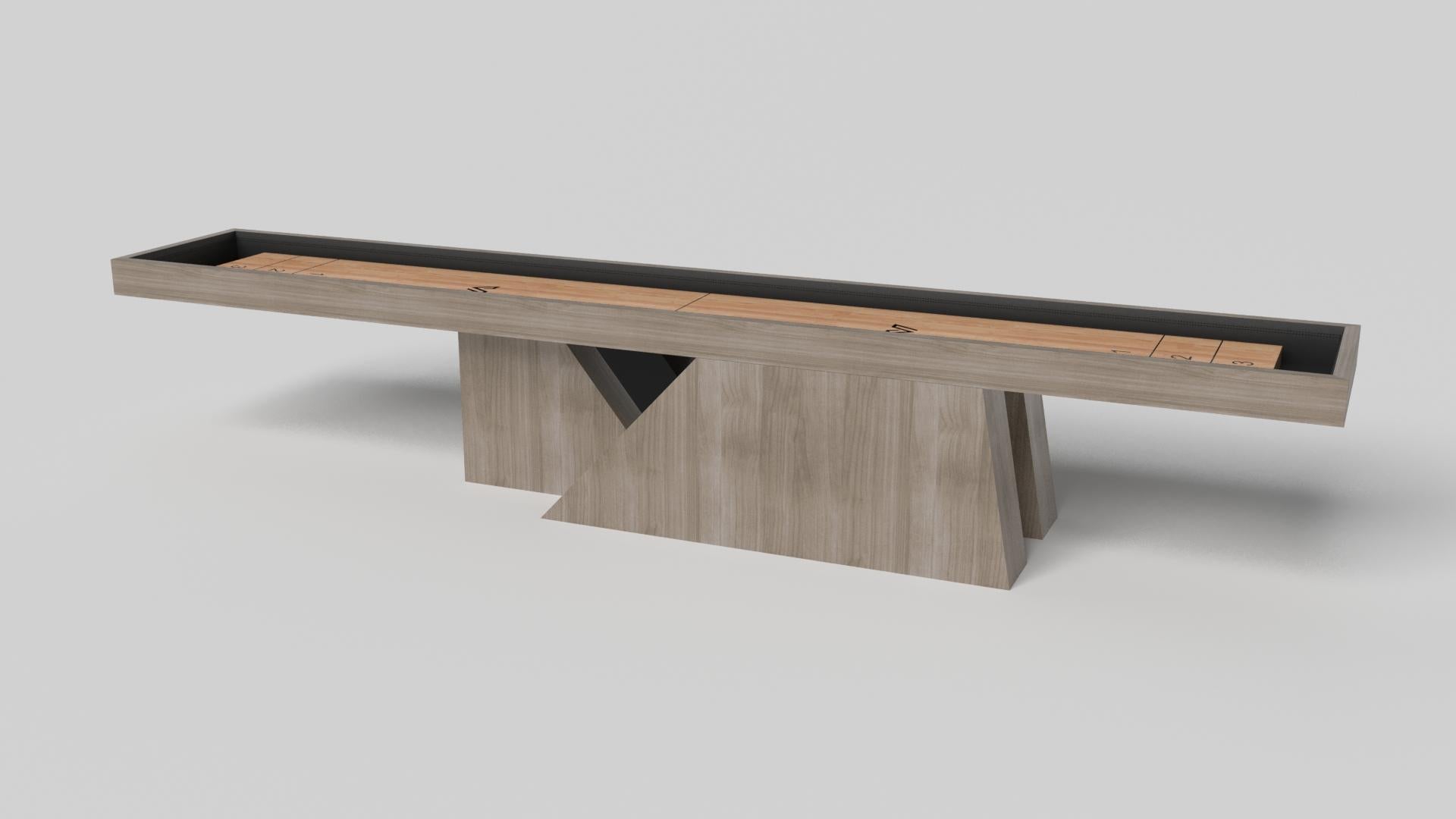 An asymmetric base creates a free-floating silhouette, making the Stilt shuffleboard table in chrome with walnut a compelling, contemporary addition to the modern home. Crafted from durable metal with solid walnut wood accents, this luxury