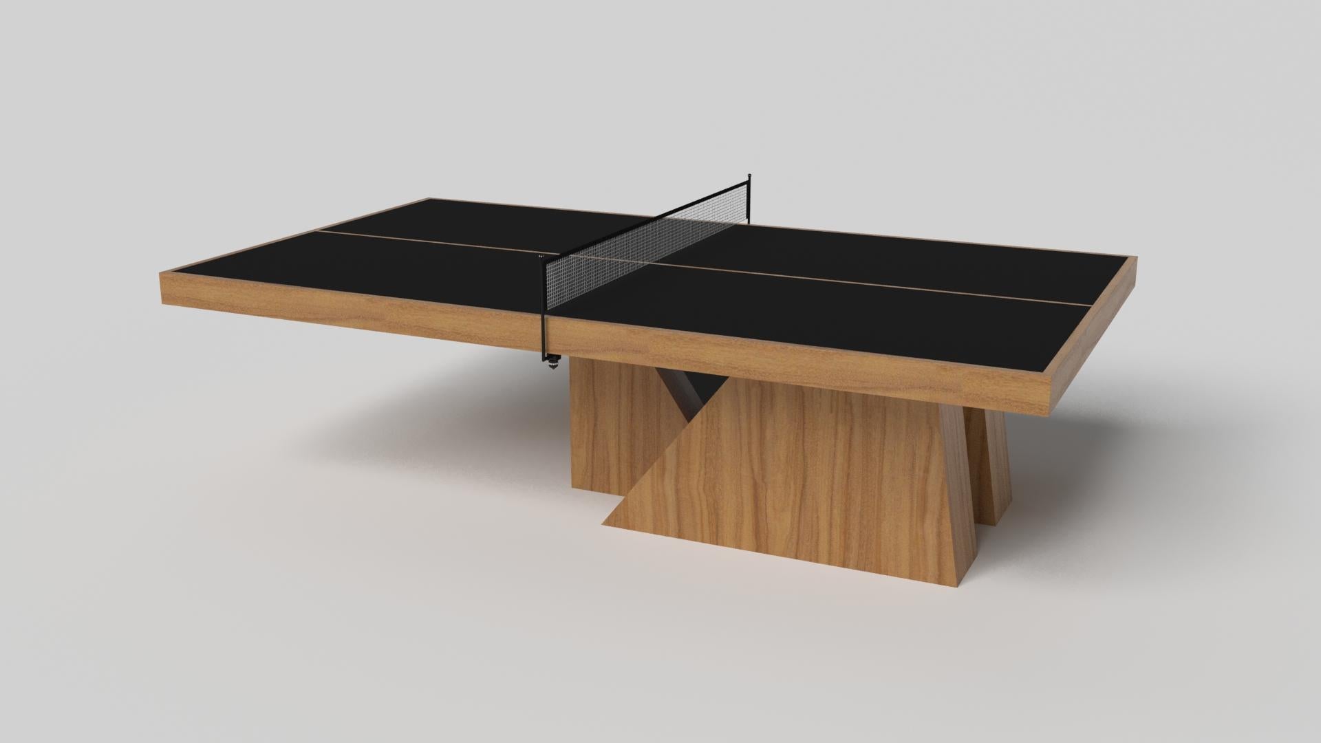 An asymmetric base creates a free-floating silhouette, making the Stilt table tennis table in chrome with walnut a compelling, contemporary addition to the modern home. Crafted from durable metal with walnut wood accents, this luxury handcrafted