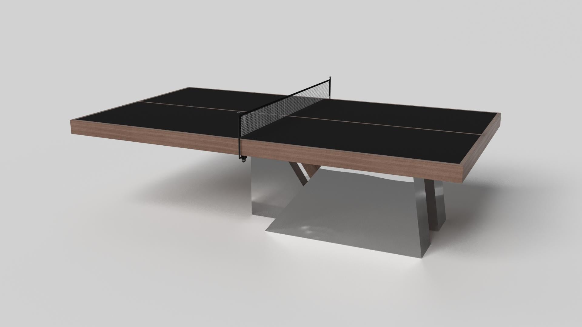 An asymmetric base creates a free-floating silhouette, making the Stilt table tennis table in chrome with walnut a compelling, contemporary addition to the modern home. Crafted from durable metal with walnut wood accents, this luxury handcrafted