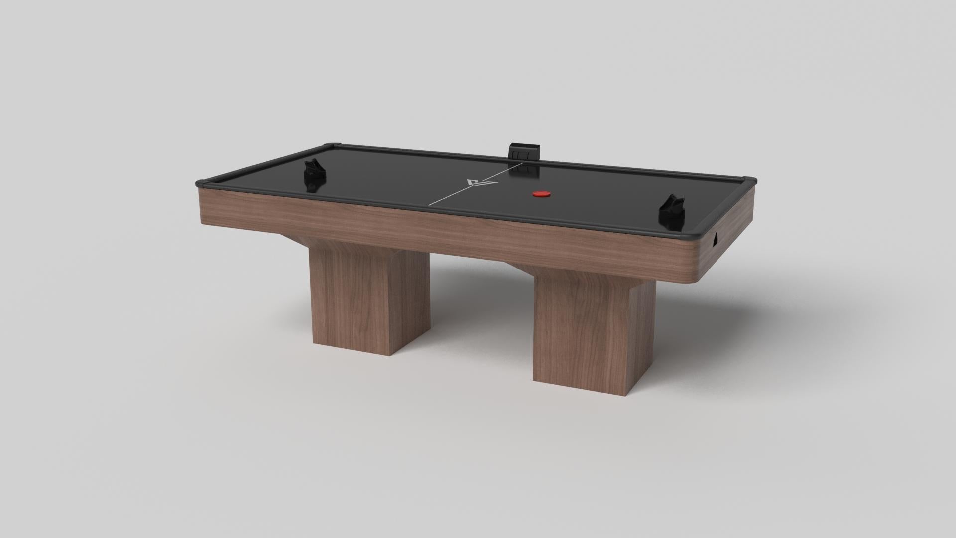 Minimalist design meets opulent elegance in the Trestle air hockey table. Detailed with a professional surface for endless game play, this contemporary table is expertly crafted. Square block legs give it a stark, geometric look that contributes to