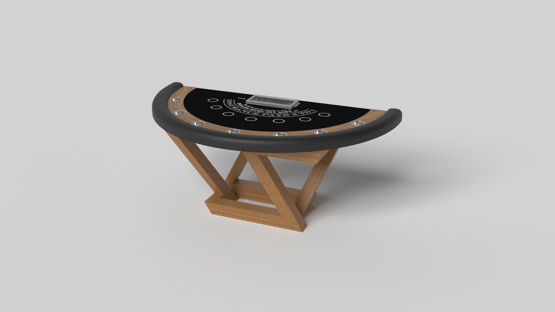 Composition contemporaine de lignes pures et d'arêtes épurées, la table de blackjack Trinity en noir est une expression élégante du design moderne. Fabriquée à la main dans un design semi-circulaire avec un support à jetons et des cercles de paris,