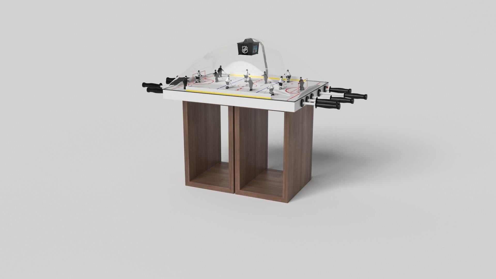 Supported by two rectangular open pedestals as the base, this handcrafted bubble hockey table is modern and minimalistic with its combination of simple, geometric forms. Viewed from the front, the use of negative space is evident; viewed from the