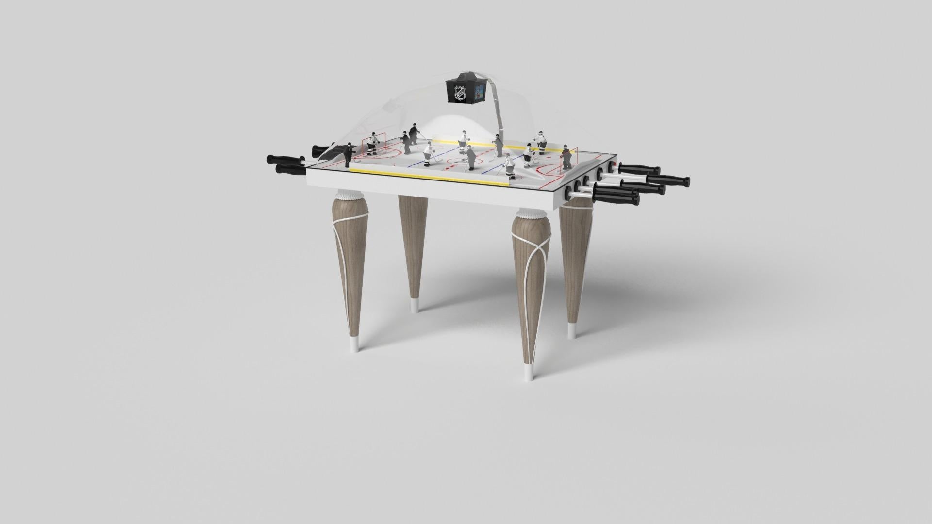 Champagne gold accents add undeniable elegance to this luxury dome hockey table. Offering superior playability and uncompromised style, this design features hand carved details, decorative metal elements, and metal sabots at the bottom of each leg.