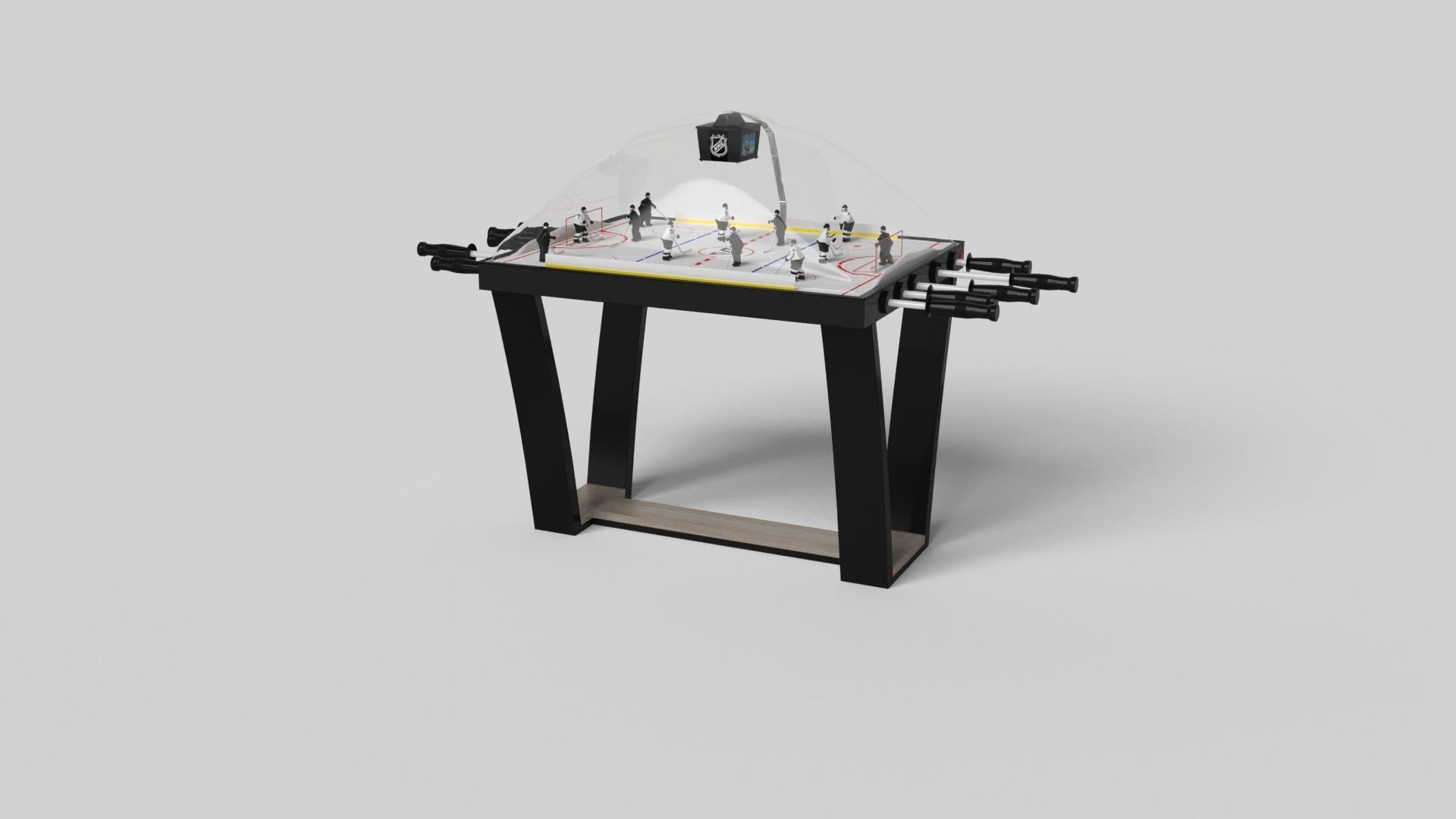 Con una base metálica en forma de I, patas metálicas ligeramente inclinadas y un tablero de madera en contraste, la mesa de hockey de cúpula Elite destila sofisticación moderna a la vez que evoca una sensación de diseño art déco. Esta mesa es una