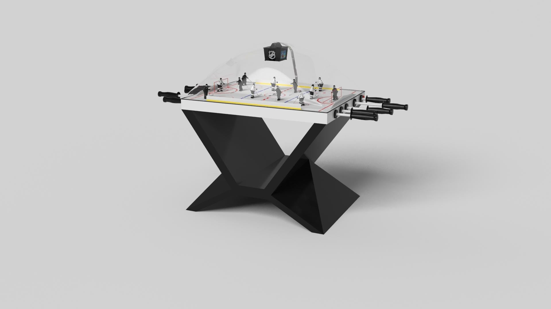 In chrome, the Kors dome hockey table is a superior example of contrasting geometric forms. This table features an angular base that highlights the beauty of negative space from the front view. From the side view, it offers a completely different