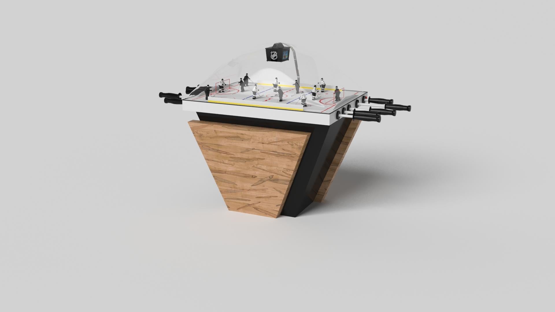 Hecha a mano con líneas limpias, ángulos agudos y una base piramidal, la mesa de hockey de cúpula Vogue en cromo con negro consigue el equilibrio perfecto entre el estilo de inspiración deportiva y el diseño contemporáneo. Intemporal en su atractivo