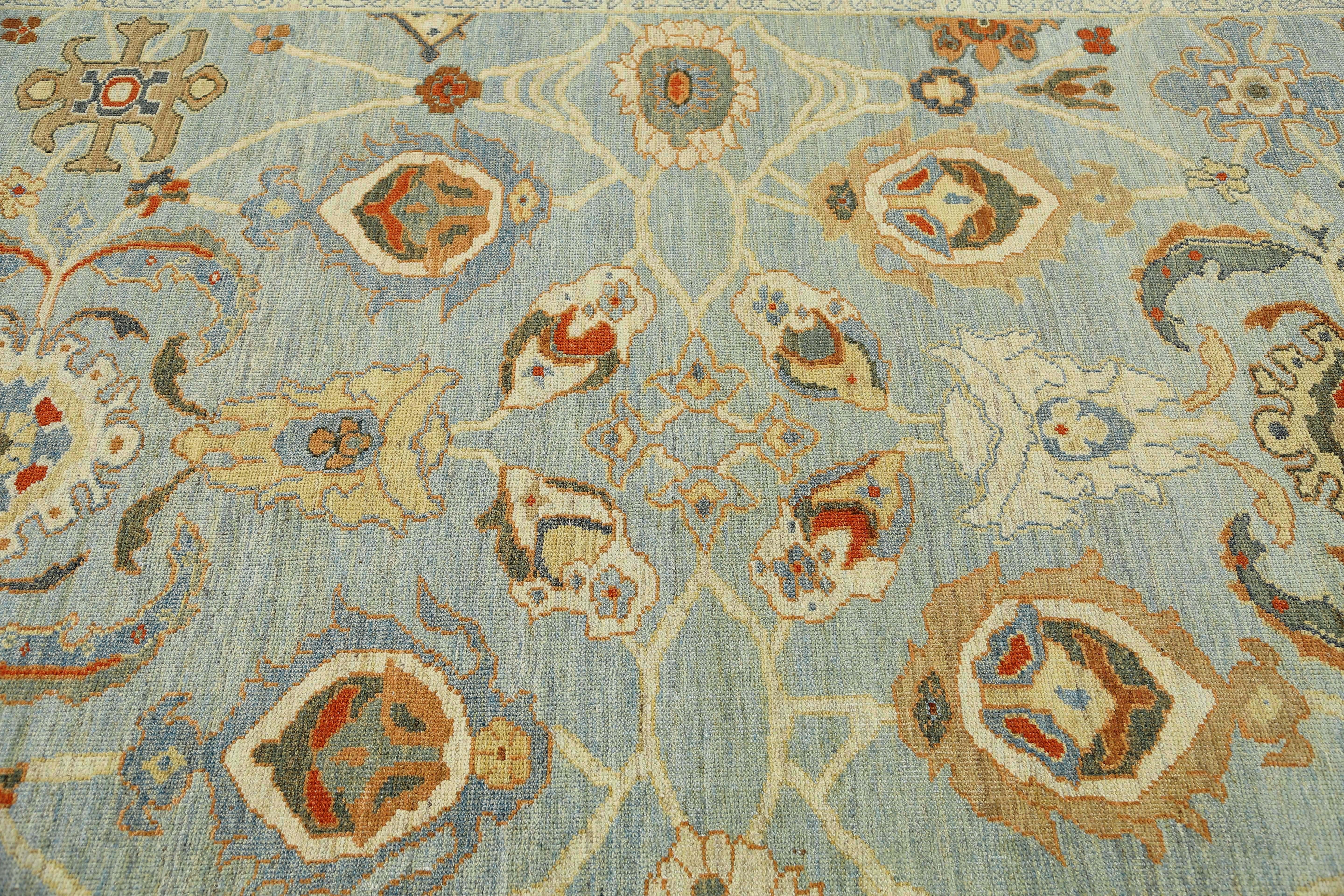 Introducing our stunning handmade Turkish Sultanabad rug with a light blue background and intricate color combination and design. Measuring 8'2'' by 10'2'', this rug is the perfect addition to elevate any space. The intricate design is carefully