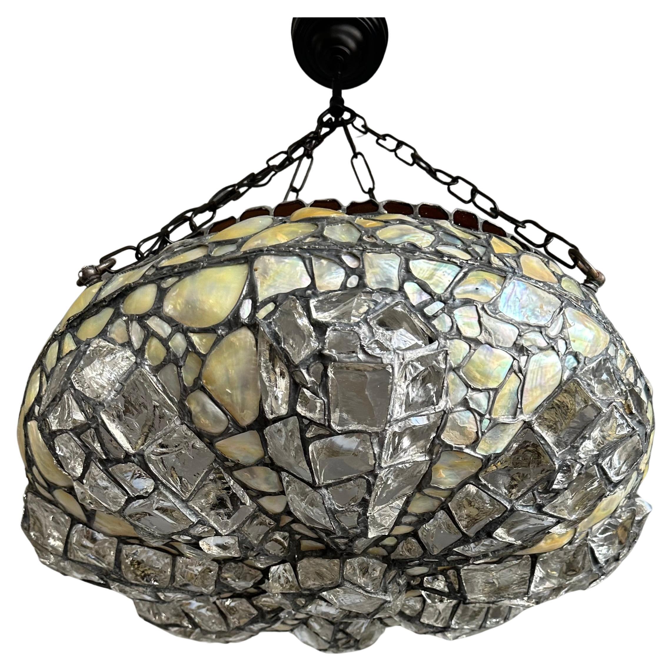 Rare inlaid 'chunky glass' light fixture from the early 1900s.

This handcrafted, chunky stained glass light fixture is the perfect blend of artistry and functionality. With early 20th century lighting being one of our specialities we are always