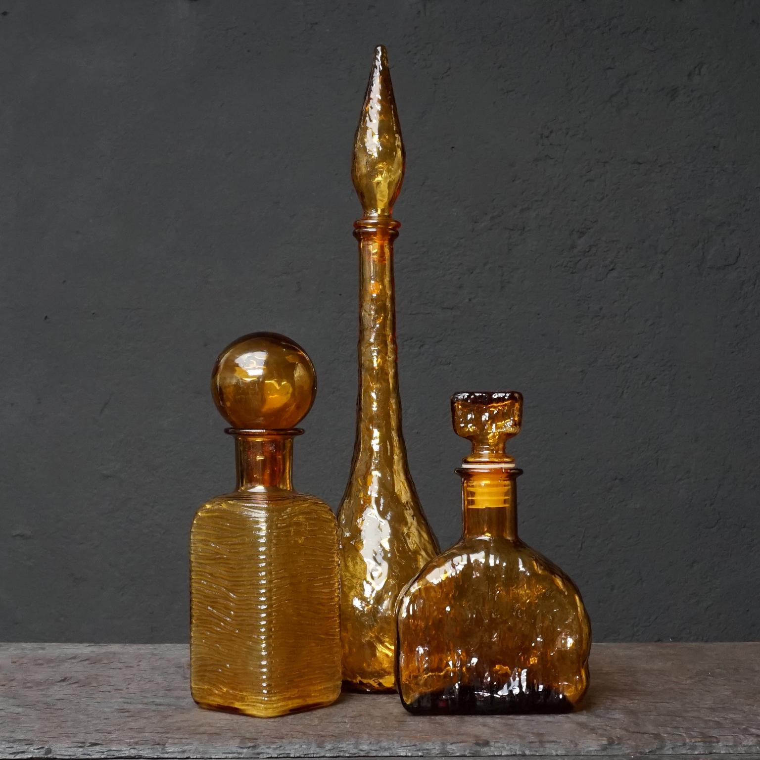 Eleven 1960s Italian Empoli Rossini Amber Genie Glass Bottles Vase and Candy Jar 1