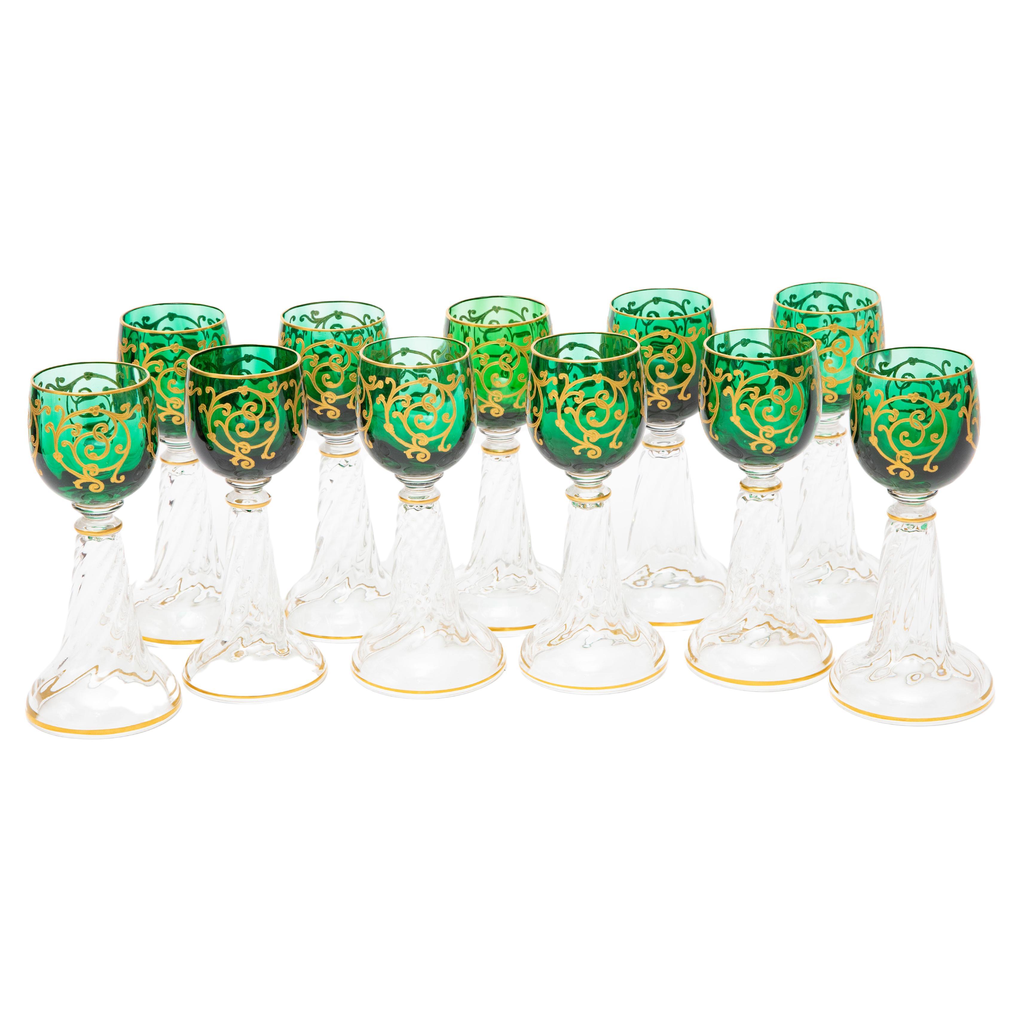 A striking set of 10 antique wine goblets with a hollow trumpet based and gorgeous raised tooled gilding on a dark green ground. Unique and in quite lovely antique condition. These will mix and match in with all your fine table top