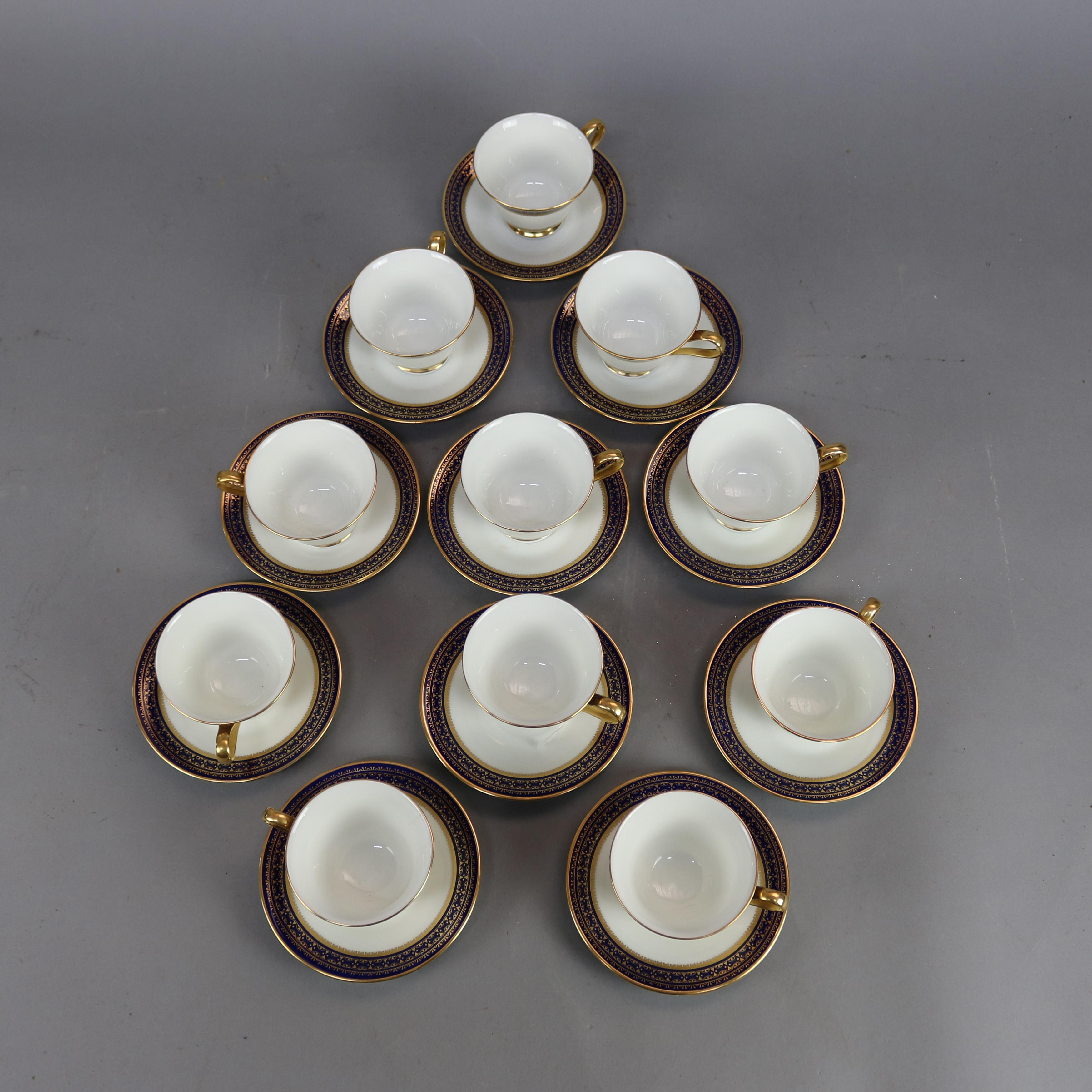 A set of eleven bone china cups and sauces by Oxford (division of Lenox) in Corina pattern offer cobalt blue and gilt decoration, cups are footed, 20th century

Measures: Saucer & cup 3