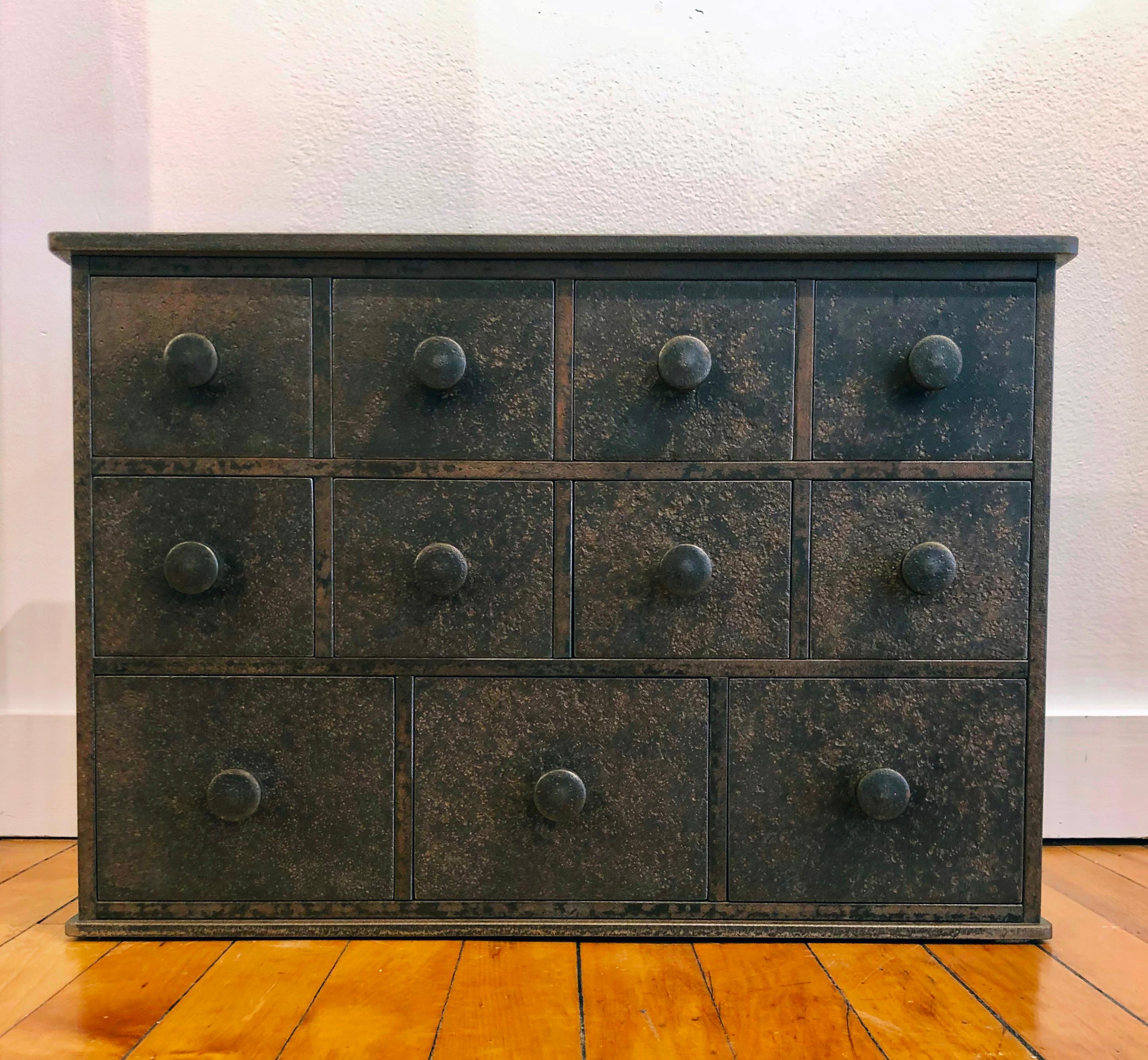 This eleven drawer cabinet is inspired by Shaker furniture. Fully functioning with three rows of drawers of varying sizes and handmade hardware, this steel cabinet is by renowned furniture maker Jim Rose. With its timeless simplicity, this Shaker